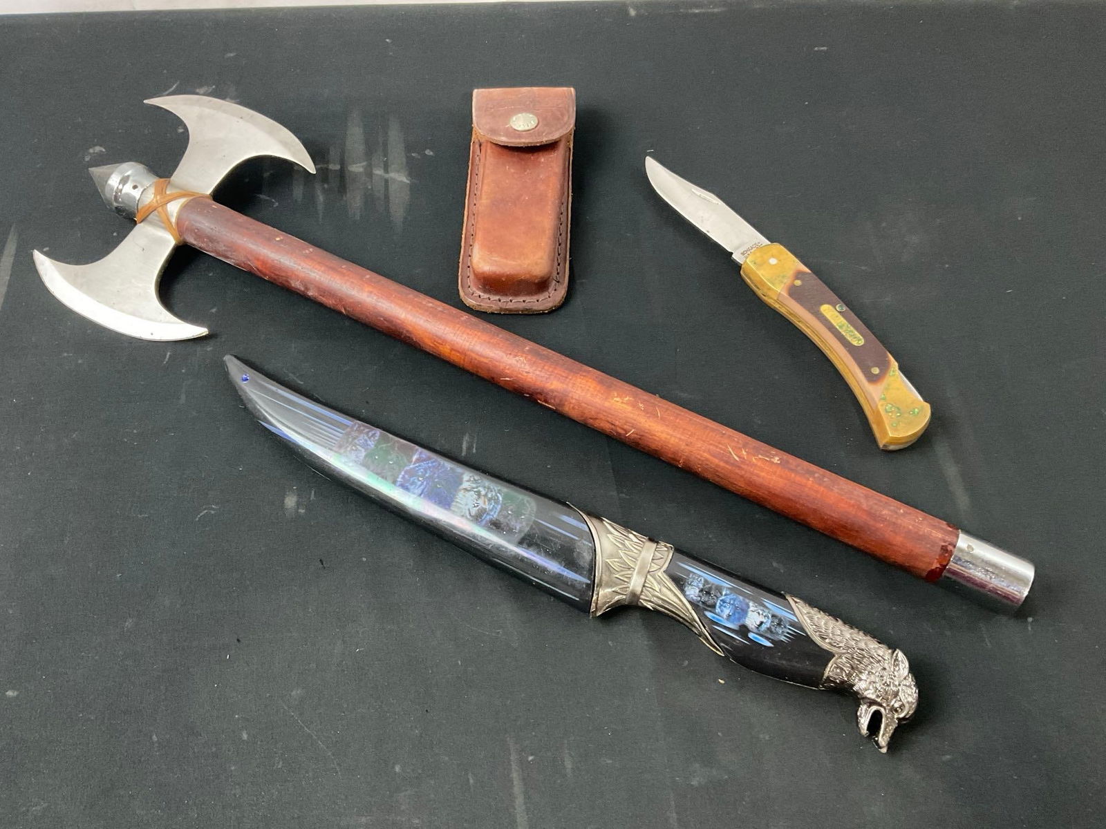 Schrade Old Timer 7OT Folding Knife, Double Edged Axe, & Fixed Blade Knife w/ Sheath: Appears to be in good shape, the Schrade knife has some green oxidation on it, and some finish wear. The axe measures approx 21 inches long. See pics. E-2960