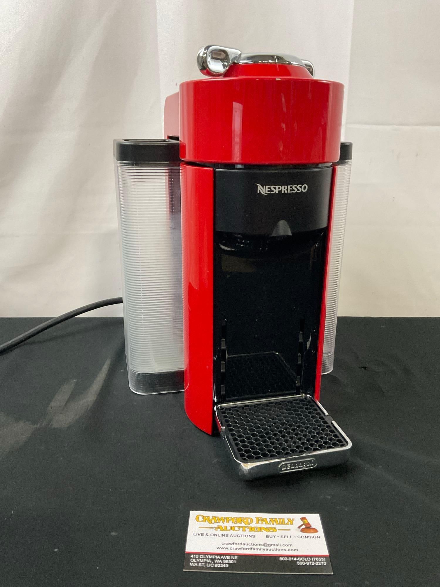 Nespresso Household Coffee Maker, model ENV135R, Red in color: Serial number 22130 S300075. Appears to be in good shape. Tested and working. Measures approx 12 inches tall. See pics. E-2683