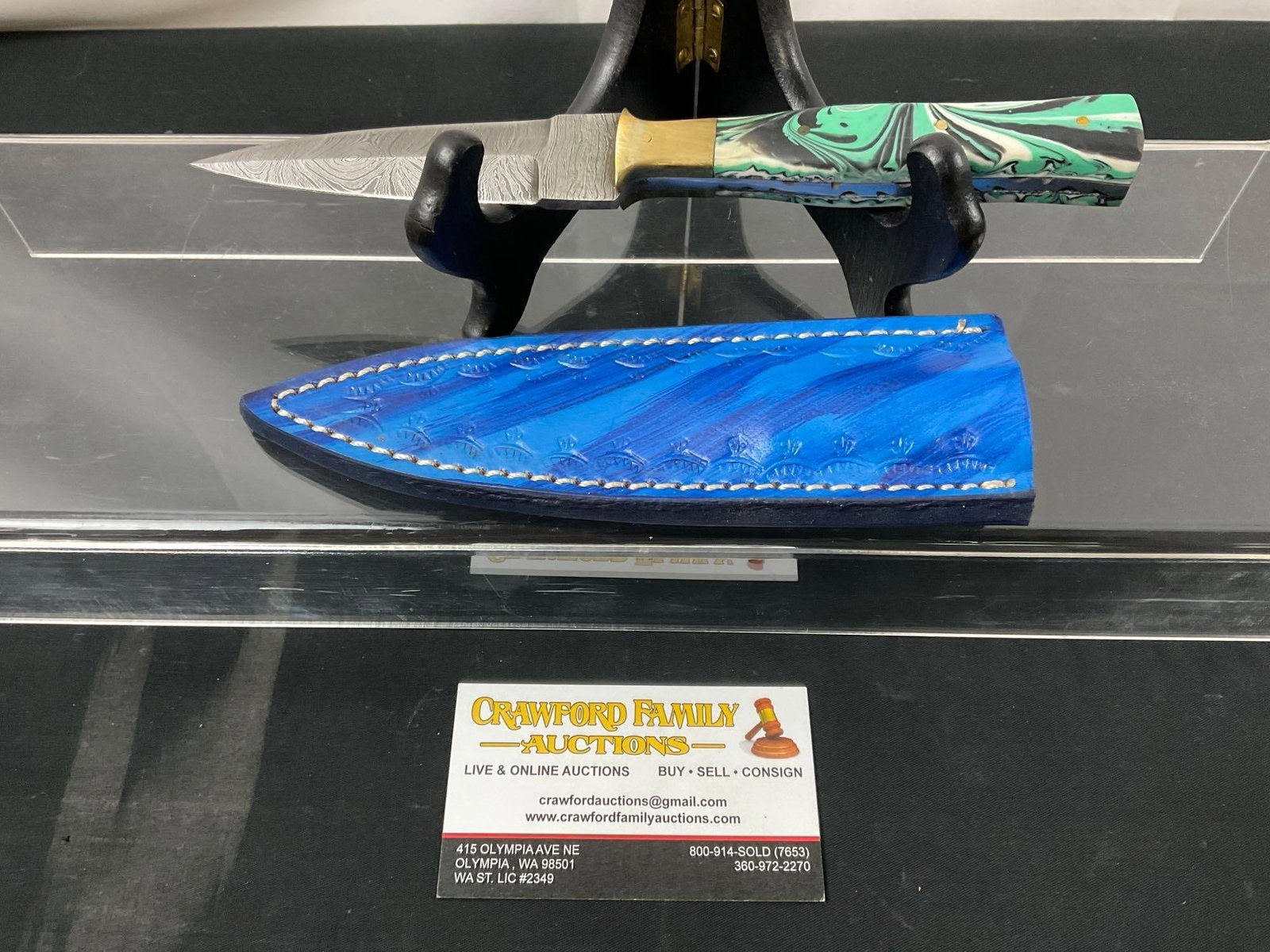 Handmade Damascus Steel Knife w/ Mint/Black/White Resin Handle & Custom Blue Leather Sheath: Made from several layers of 1095 and 15N20 steel folded multiple times creating between 288 and 512 layers to form unique patterns in the blades. Each handle is custom fit as are the sheaths. Approx 4