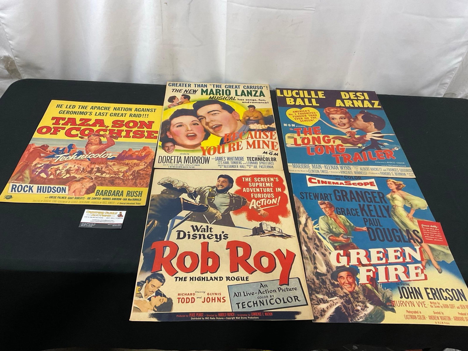 Vintage 1950s Film Posters, Rob Roy, Green Fire, Because Youre Mine, The Long Long Trailer... &: Taza, Son of Cochise w/ actors like Rock Hudson Grace Kelly, Lucille Ball. Appears to be in fair to good shape. The pieces show a bit of bends and signs of age. The posters measure approx 15 x 13 inch