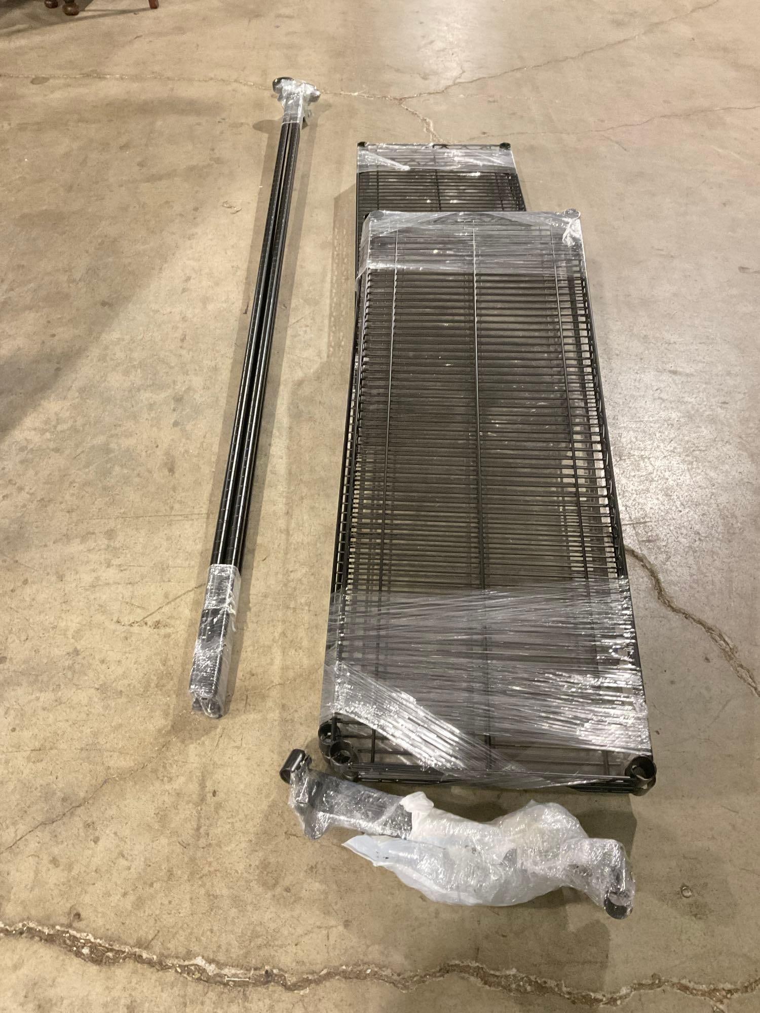 NSF Storable Tall Black Shelving Rack w/ 7 Shelves - Unassembled: On wheels. Each shelf is 18"x48". See pics. T-2940 *Oversized shipping may apply*