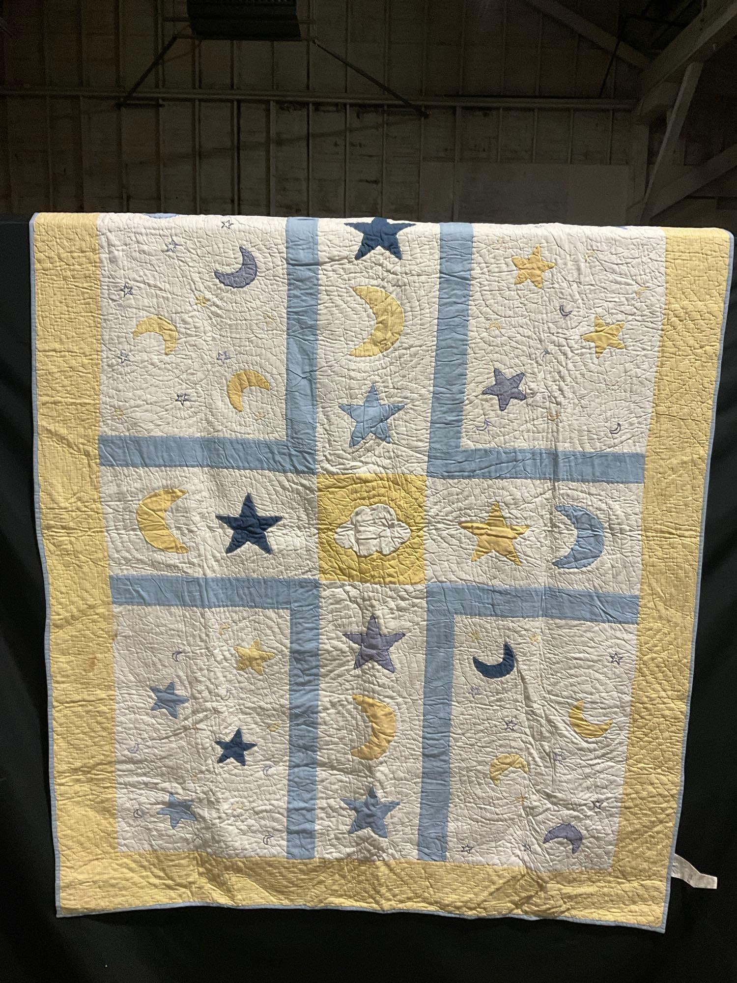 Blue & Yellow Sleepy Designs on White background Quilt Handmade in India, measures 68h x 86w inches: Consignor says the pieces are handmade, some made locally and some purchased. Appears to be in good shape. The outside dimensions measures approx 68h x 86w inches. See pics. E-3190