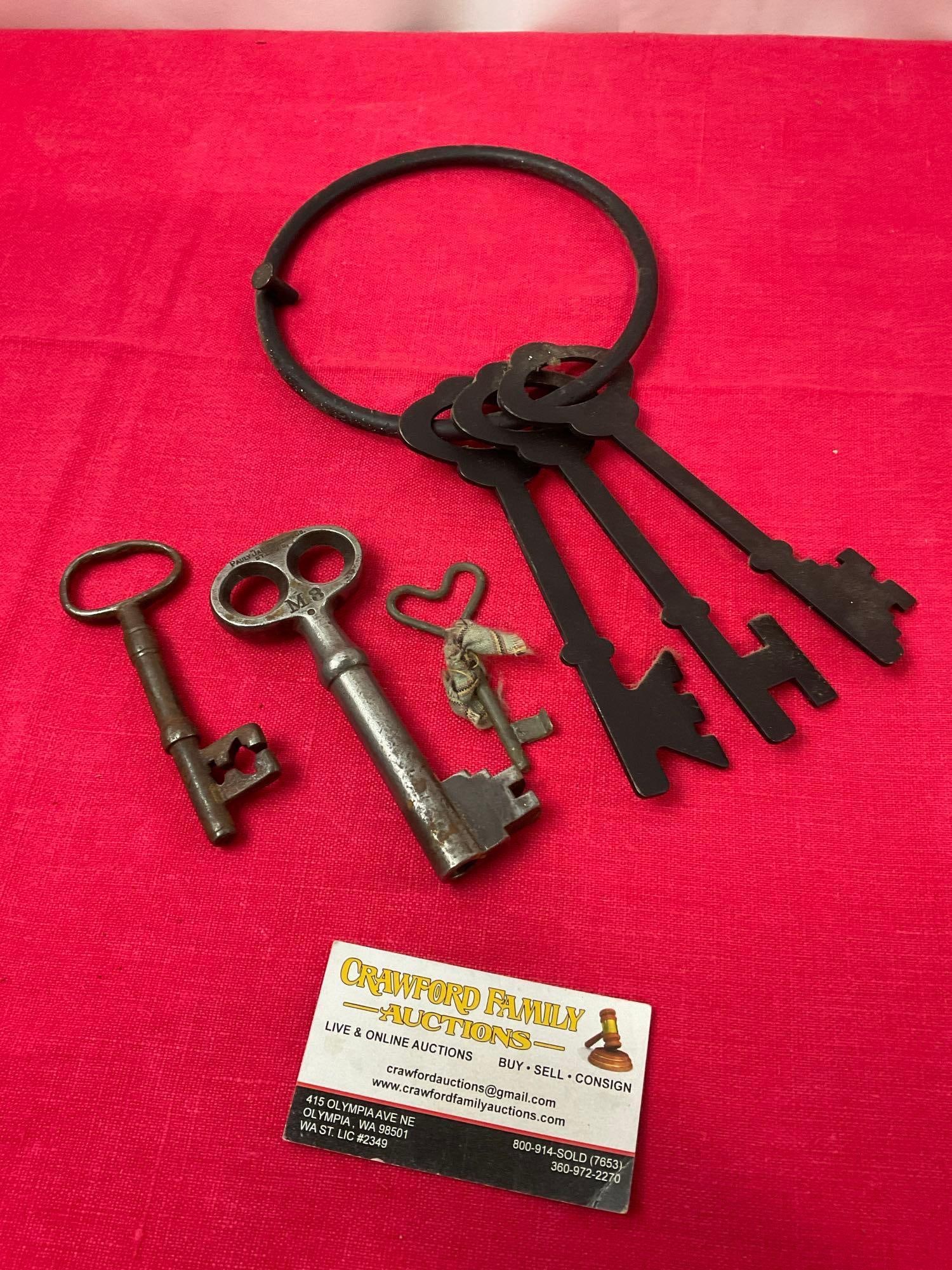 Pauly Jail Building Co. Key, pair of Skeleton Keys, and Wall Hanging (1 of 4)