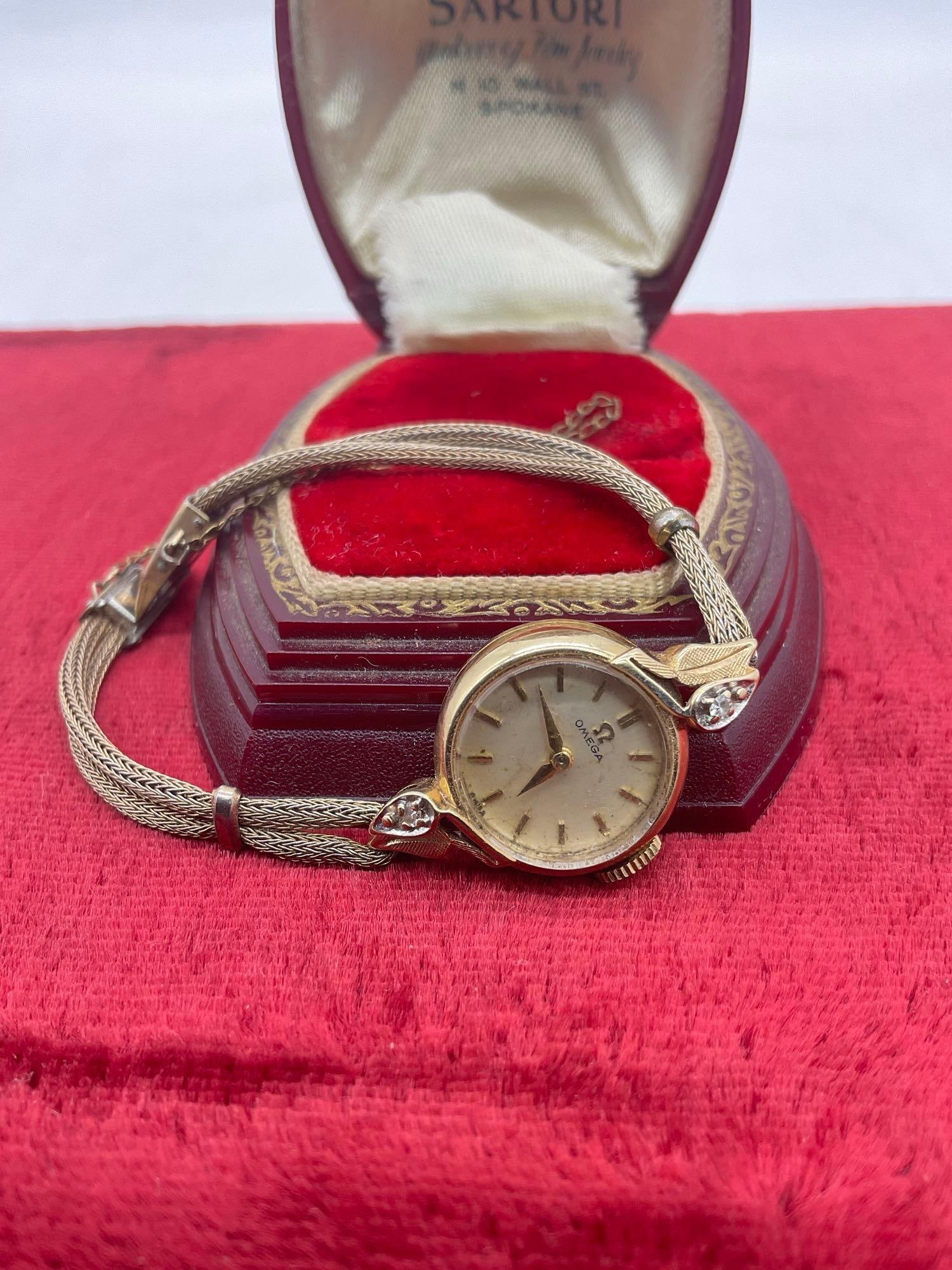 Elegant Early 1960's women's Omega 14k gold watch w/ 2 diamonds Inscribed "Terry lee from Dad 1963: SC-3280 Case is 14k Gold and marked on the inside of the case, watch needs service 