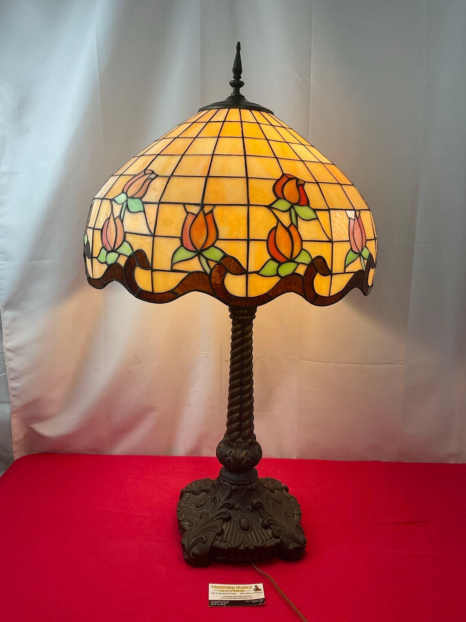 Tiffany Style Stained Glass Lamp, 35 inches tall, tested & working, orange & amber glass, flowers: Appears to be in good shape. The piece measures approx 35 inches tall, and the shade measures approx 12h x 20d inches. Tested and working. See pics. E-3290 *Freight Required if shipped*