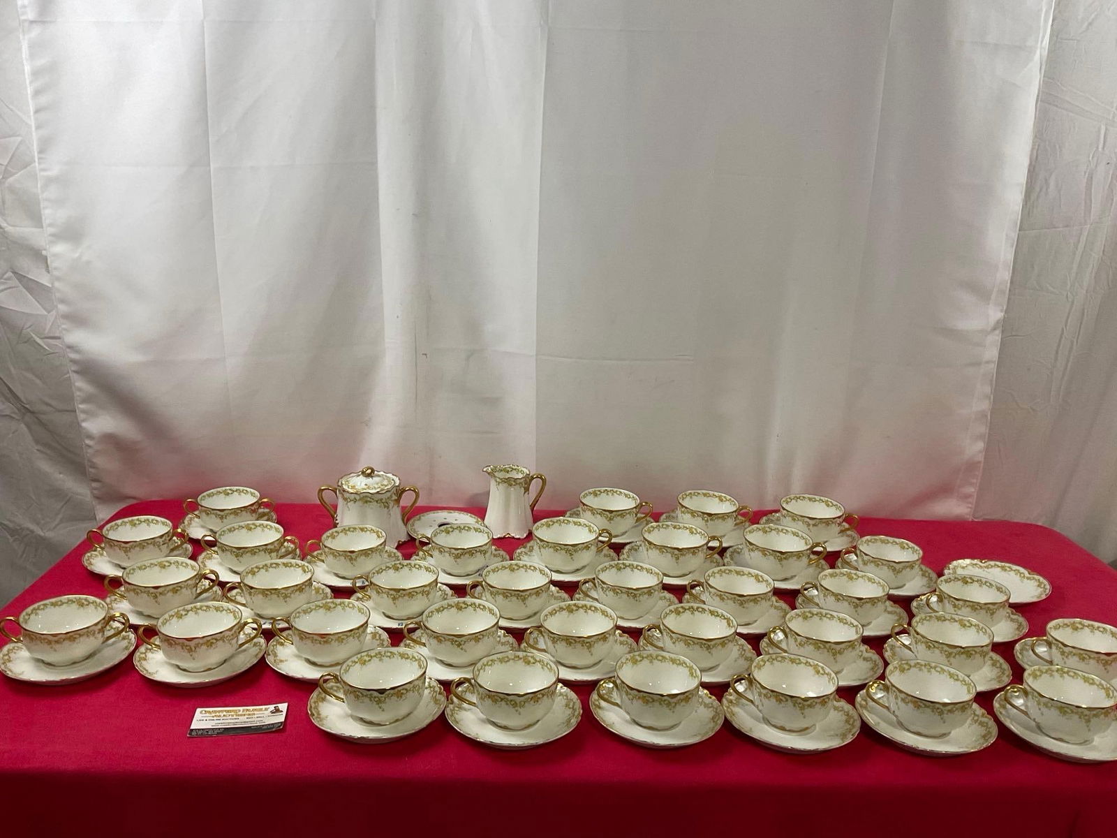 Vintage Haviland & Co Limoges China, Green/Yellow w/ Gilt Edges, approx 74 pieces: Marked for H.S. Barney on the bottom. Schenectady NY. Includes 6 Double Handled cups & matching saucers, 6 larger cups & saucers, 23 cups w/ 24 saucers, cream & sugar container w/ trivet.