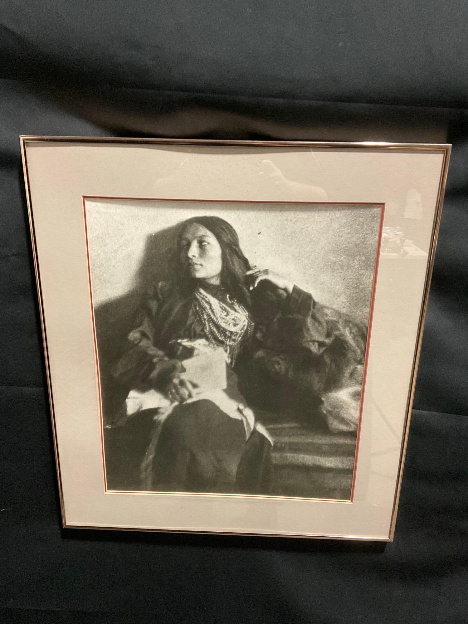 Framed Photograph titled A Sioux Girl by Joseph T. Keiley, 25h x 22w: The sticker on the back claims that this piece is a 1898 platinum printed photocopy, could be true. The process is monochromatic. Appears to be in good shape. The piece measures approx 25h x 22w inche