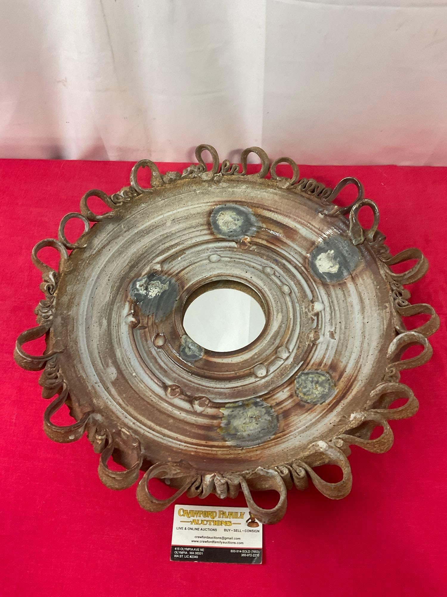 Unique Glazed Stoneware Mirror, 19 inches in diameter, cork on the back, wall hanging: Appears to be in good shape. The piece measures approx 19 inches in diameter, the mirror is 4 inches in diameter. See pics. E-3290