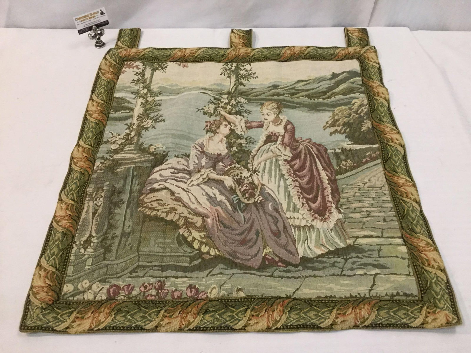 Hanging tapestry of regal lake estate scene w/ floral border, measures approx 30 x 35 inches (1 of 4)