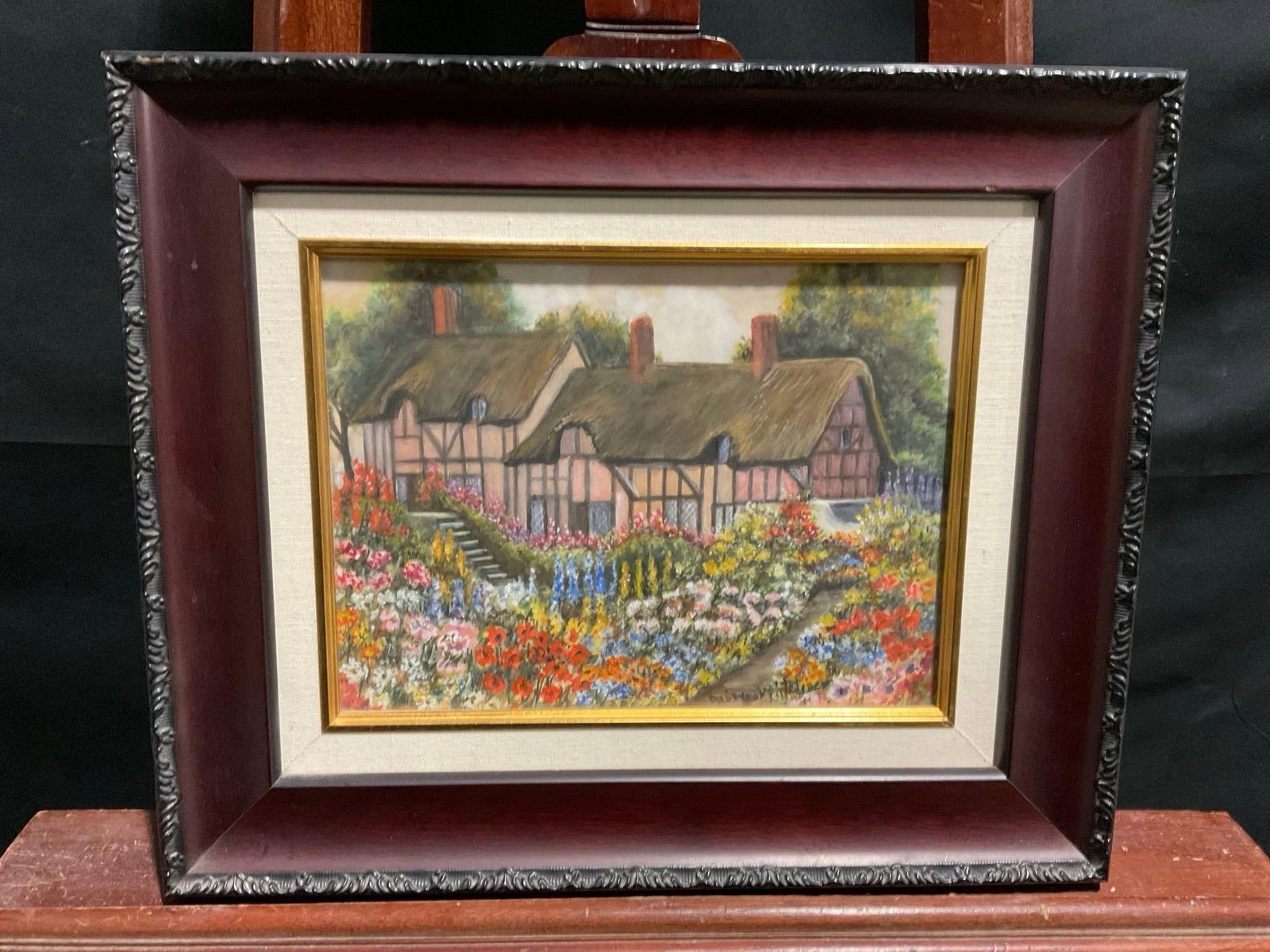 Framed Original Watercolor titled Anns Flower Garden by Daisy Houghtaling, 1946: Appears to be in good shape, has been repaired, includes the original back that has the info on it. Seems to be signed on the lower right, but it is illegible. The outside dimensions measure approx 14