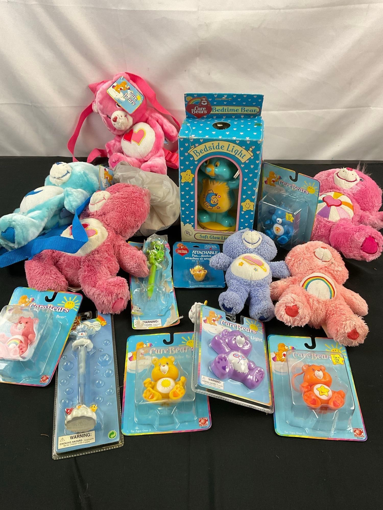 Collection of Care Bears Collectibles incl Mainly Figurines & Plushies - See pics: Also includes mug, wearable bears, Pens, & Bedside light. T-3640