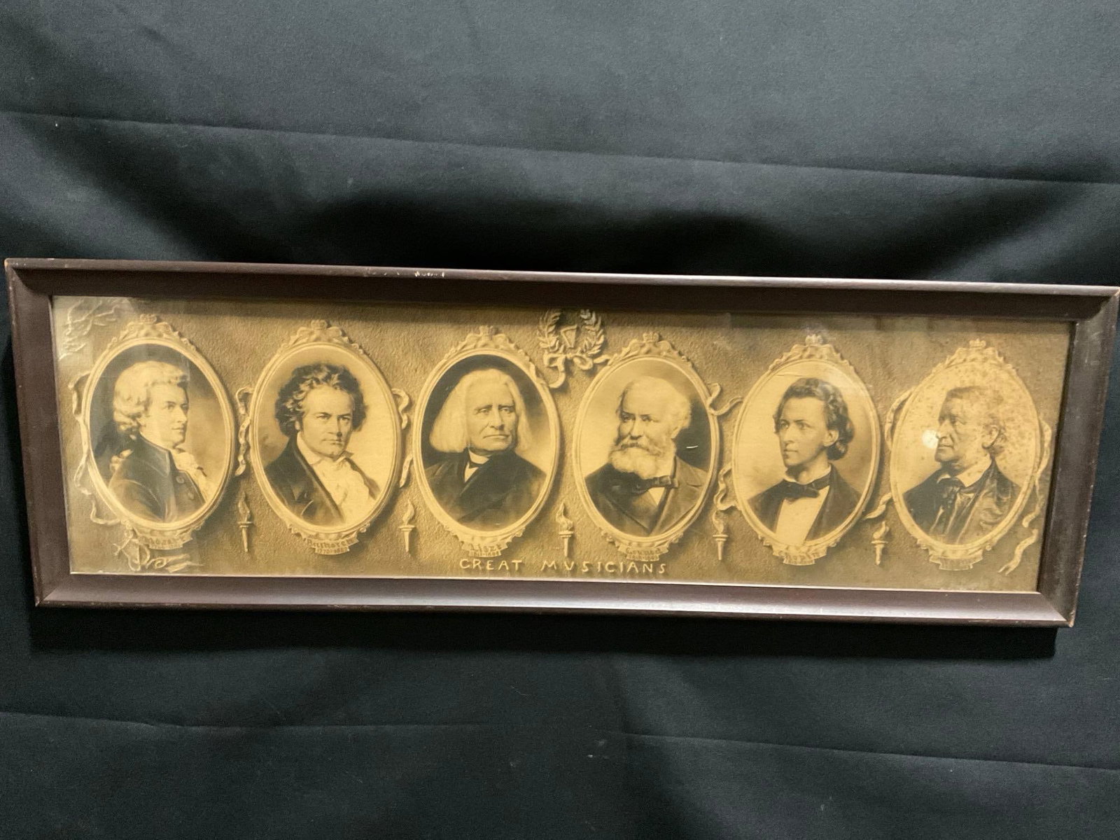 Framed Portraits of Great Musicians, Mozart, Beethoven, Liszt, Gounod, Chopin, Wagner, 10h x 30.5w: Shows a portrait of Mozart, Beethoven, Liszt, Gounod, Chopin, Wagner. Appears to be in good shape. The outside dimensions measures approx 10h x 30.5w inches. See pics. E-3680