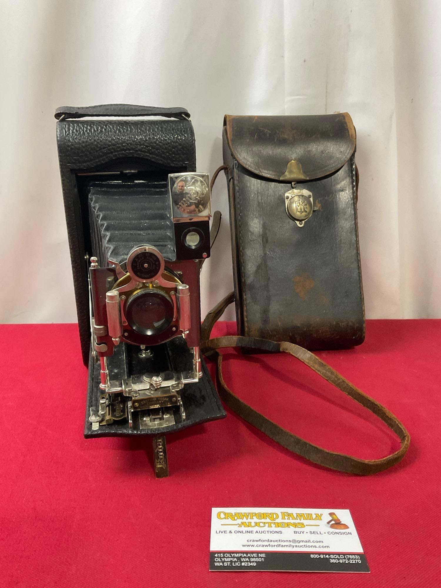 Antique Kodak Folding Pocket Camera No 3A, w/ original case marked EKC: To open, press the leather indent on the side. Appears to be in good shape, especially for the age of the piece, the bellows seem intact, and the shutter is accurate. The camera in the case measures a