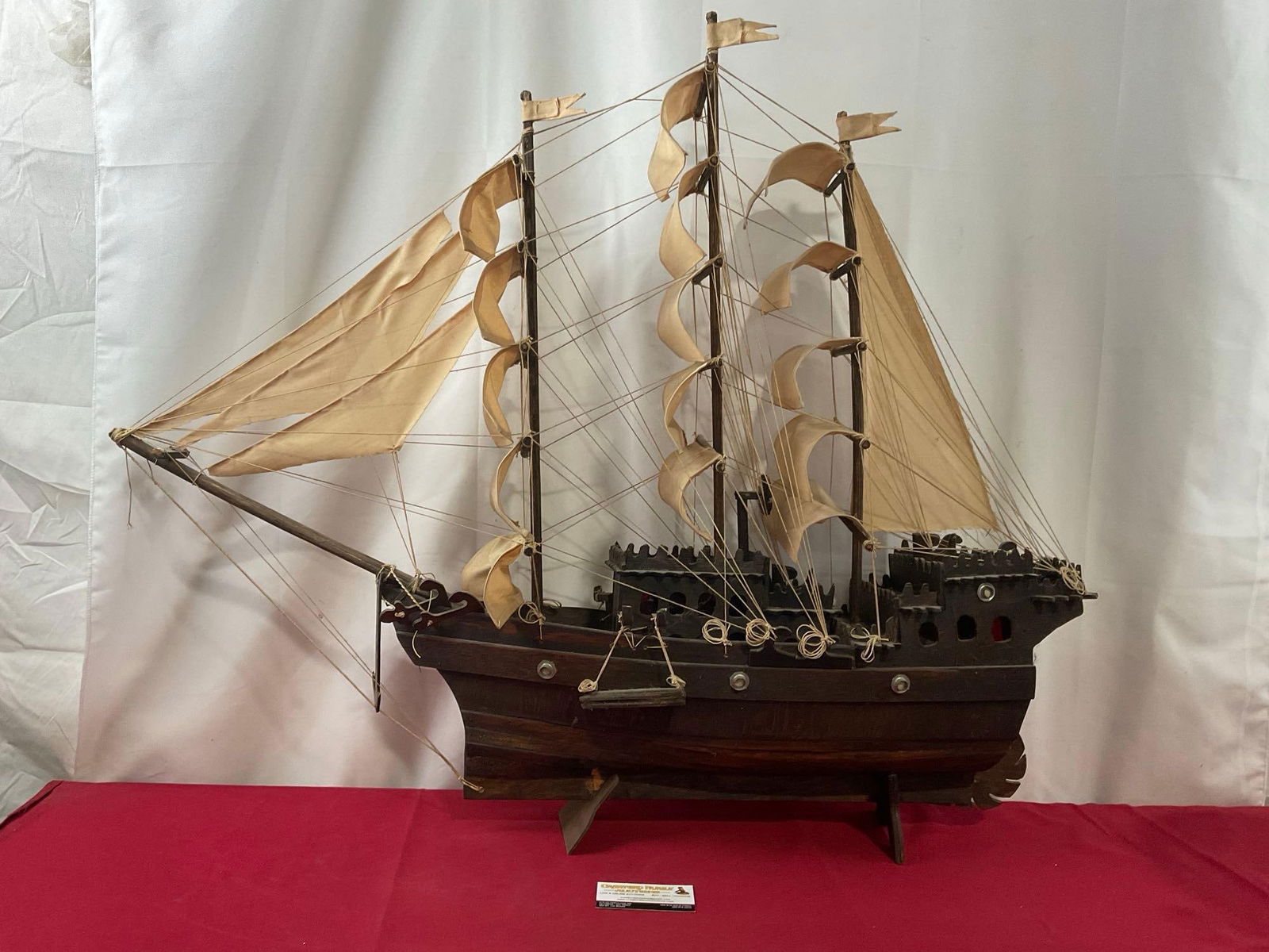 Large Wooden Ship Model, Handmade, Tinted Wood w/ rough cloth sails, approx 34h x 39L x 7d inches: *No shipping, size* Appears to be in good shape. The piece measures approx 34h x 39L x 7d inches. See pics. E-4020 *No shipping, size*