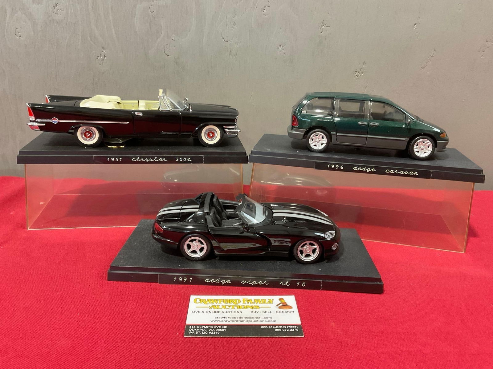 3 Diecast Car Models, 57 Chrysler 300C, 96 Dodge Caravan & Dodge Viper RT 10 in display cases: Appears to be in fair to good shape, the display case may need some cleaning, some wear can be seen on the case, The piece measures approx 9-10 inches. See pics. E-4050