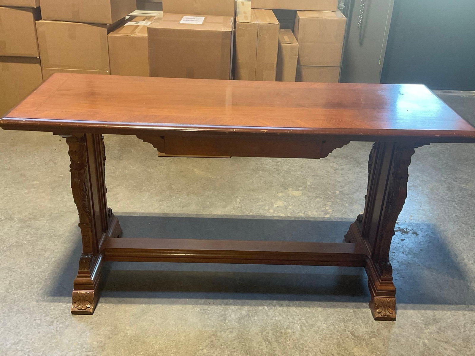Ornately Carved Antique Writing / entry way Desk, sliding drawer underneath, 31h x 60w x 22d inches: Appears to be in fair to good shape, some wear on the edges of the top surface. The piece measures 31h x 60w x 22d inches. See pics. E-4150