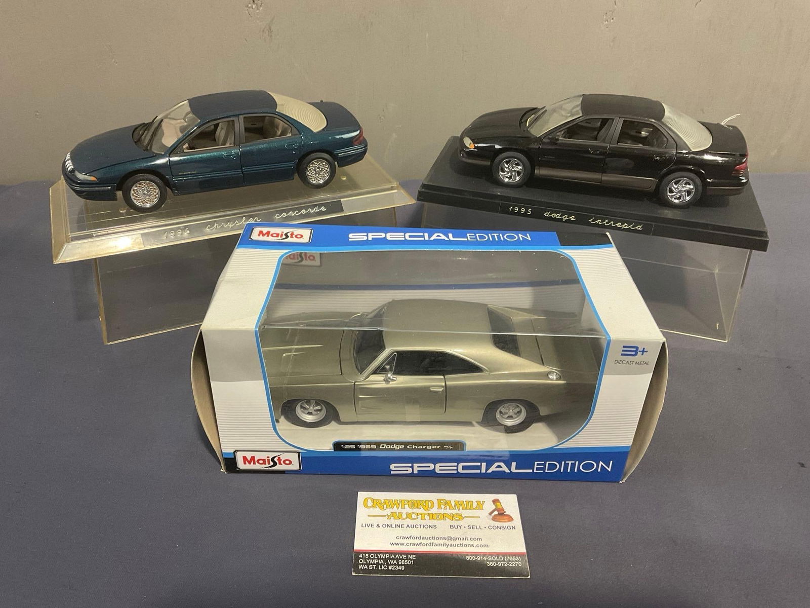 3 Diecast Car Models in Display Cases & Box, Dodge 1969 Charger & 1995 Intrepid, 1995 Chrysler Co...: All from the same consignors collection, some may have some dust from storage. Appears to be in fair to good shape. The piece fit in a box that measures approx 6.5h x 12.5w x 12.5d inches. See pics. E