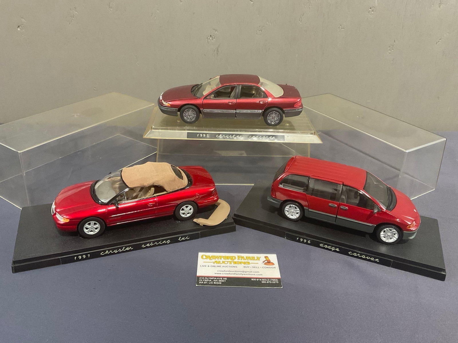 3 Diecast Car Models in Display Cases, Dodge 1996 Caravan, 1995 Chrysler Cressida & 1997 Sebring ...: About 1:24-1:25 Scale. All from the same consignors collection, some may have some dust from storage. Appears to be in fair to good shape. The piece fit in a box that measures approx 6.5h x 12.5w x 12