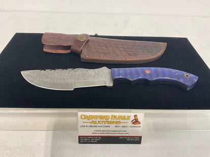 Damascus Steel 5.5 inch blade, Blue tinted & textured wood handle, Leather Sheath: Unique style, w/ two cutting edges, similar to the next lot. Made from several layers of 1095 and 15N20 steel folded multiple times creating between 288 and 512 layers to form unique patterns in the b