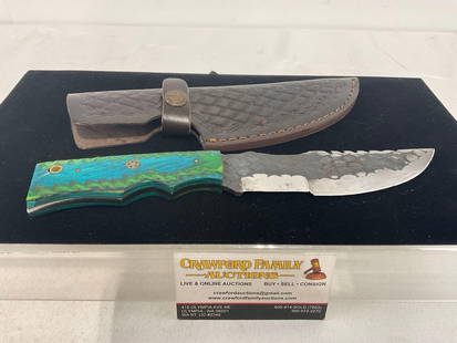 Cross Hatched Steel 5.5 inch blade, Green & Blue tinted & textured wood handle, Leather Sheath: Unique style, w/ two cutting edges, similar to the last lot. Each handle is custom fit as are the sheaths. The blade measures approx 5.5 inches long, in total measures 11.5h x 3.5w x 2d inches. See pi
