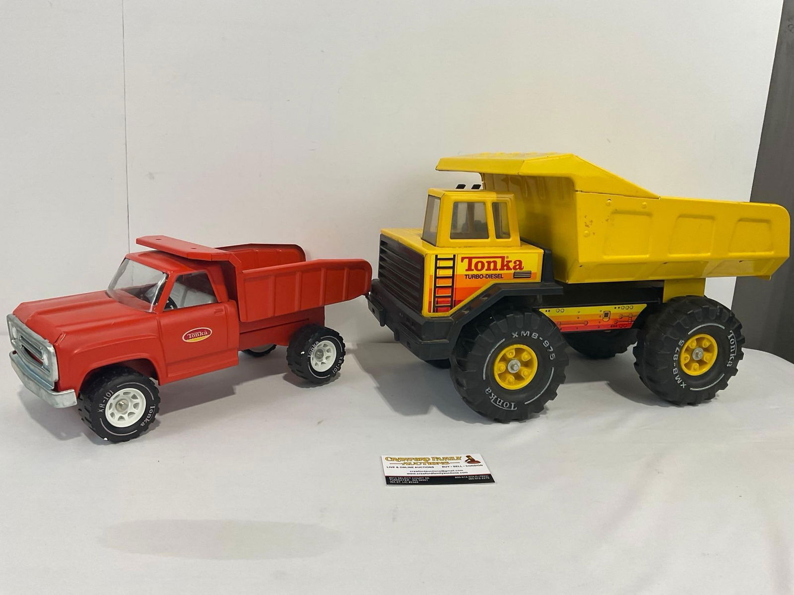 Pair of Tonka Diecast Dump Trucks, 1960s Mighty Orange, 1980s Tonka Turbo Diesel XMB-975: Appears to be in good shape. The larger piece measures approx 10.5h x 17w x 8.5d inches. See pics. E-4190