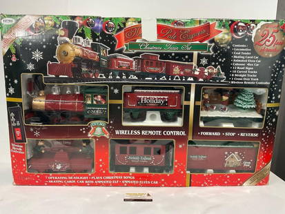 North Pole Express Christmas Train Set, some wear on box, incomplete: Includes what looks like Locomotive, Coal Tender, Skating Carol Car, Animated Elves Car, Caboose, Box Car, approx 20 pieces of track, no controller. Appears to be in good shape. The packaging shows we