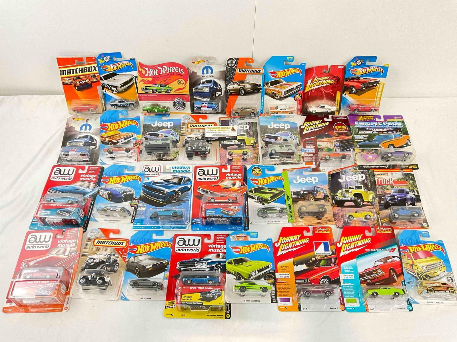 32 pcs NIP 1:64 Scale Die Cast Model Cars from Matchbox, Hot Wheels, Auto World & More!: 32 pcs NIP 1:64 Scale Die Cast Model Cars from Matchbox, Hot Wheels, Auto World & More! Minor shelf wear, condition is otherwise very good. Fits in box measuring 12" x 16" x 12" DM-4050