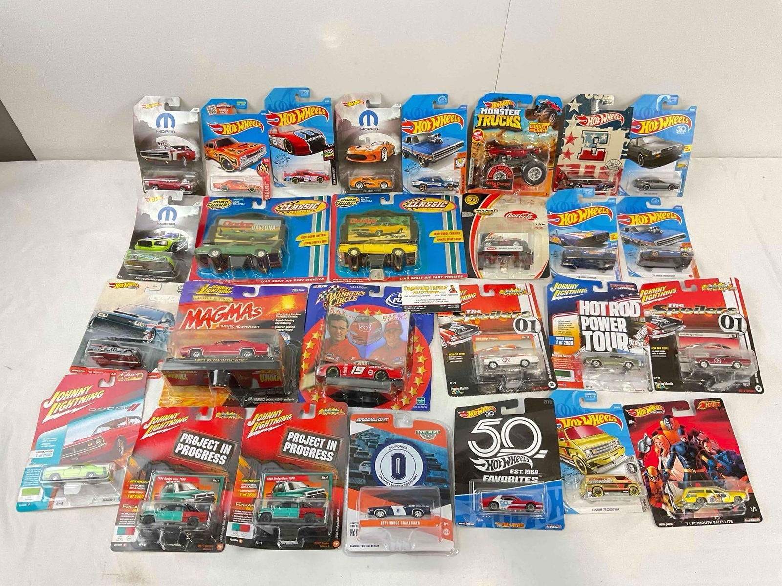 27 pcs NIP Die Cast Model Cars from Hot Wheels, Johnny Lightning, Winner's Circle & More!: 27 pcs NIP Die Cast Model Cars from Hot Wheels, Johnny Lightning, Winner's Circle & More! Minor shelf wear, condition is otherwise very good. Fits in box measuring 12" x 18" x 12" DM-4050