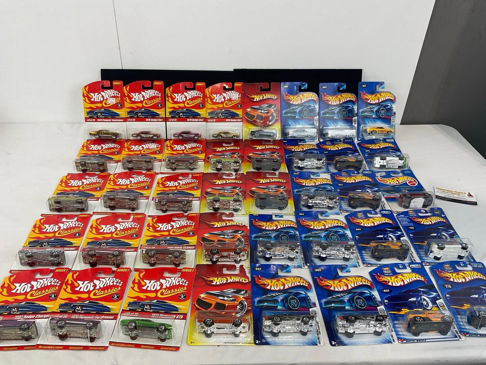 40 Hot Wheels & Hot Wheels Classics Diecast Cars, NIP 1:64 Scale, MOPAR, Dodge & Plymouth: Some 2004 First Editions. There is series 1 & series 2 cars from Hot Wheels Classics. Appears to be in good shape. The pieces fit in a box that measures approx 8h x 19w x 13d inches. See pics. E-4