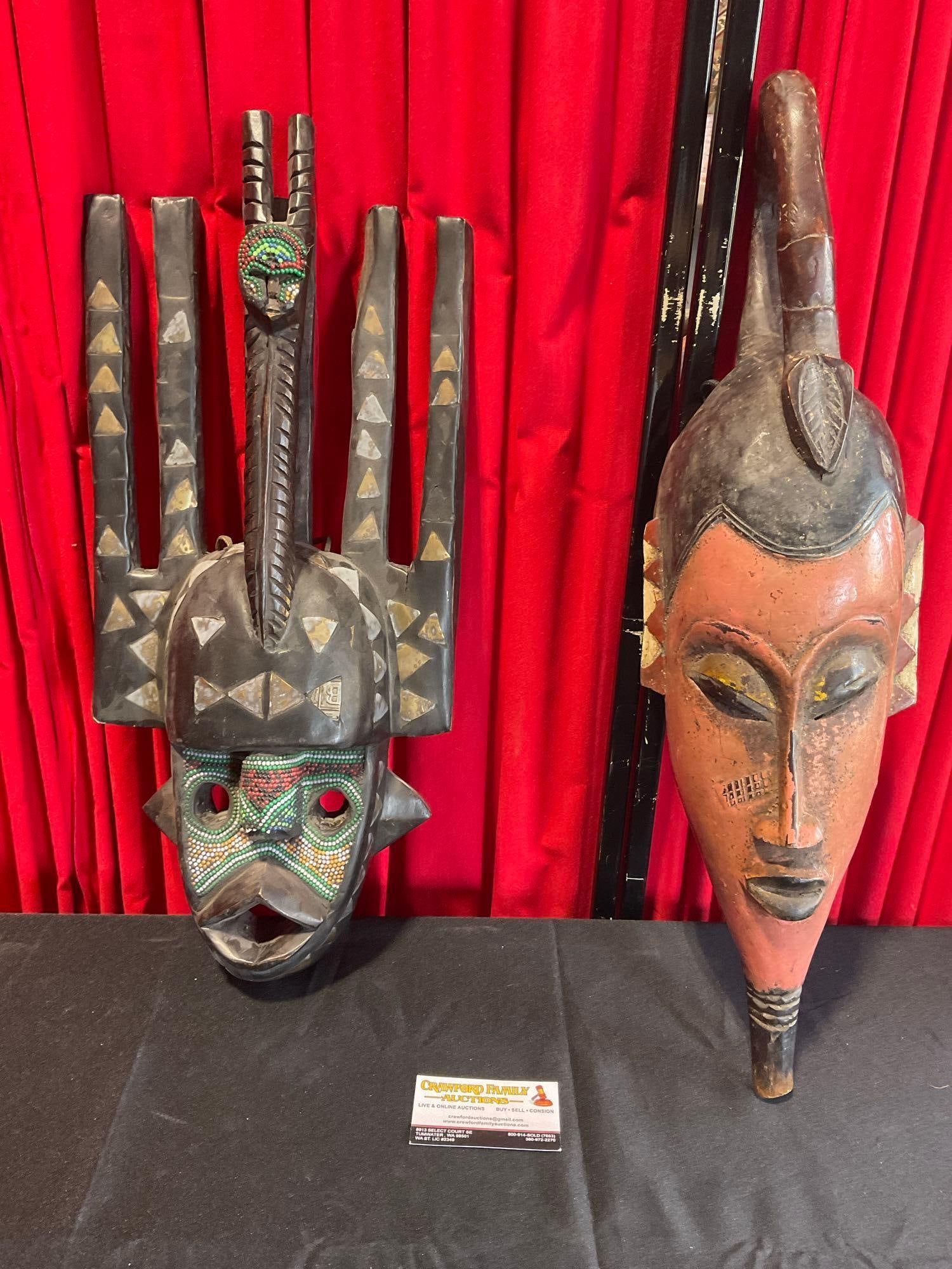 Pair of Ghanaian African Tribal Masks, Carved Wood, Bead & Brass Details, 25 inches long: Appears to be in good shape. The pieces together measures approx 26h x 10w x 11d inches. See pics. E-3980