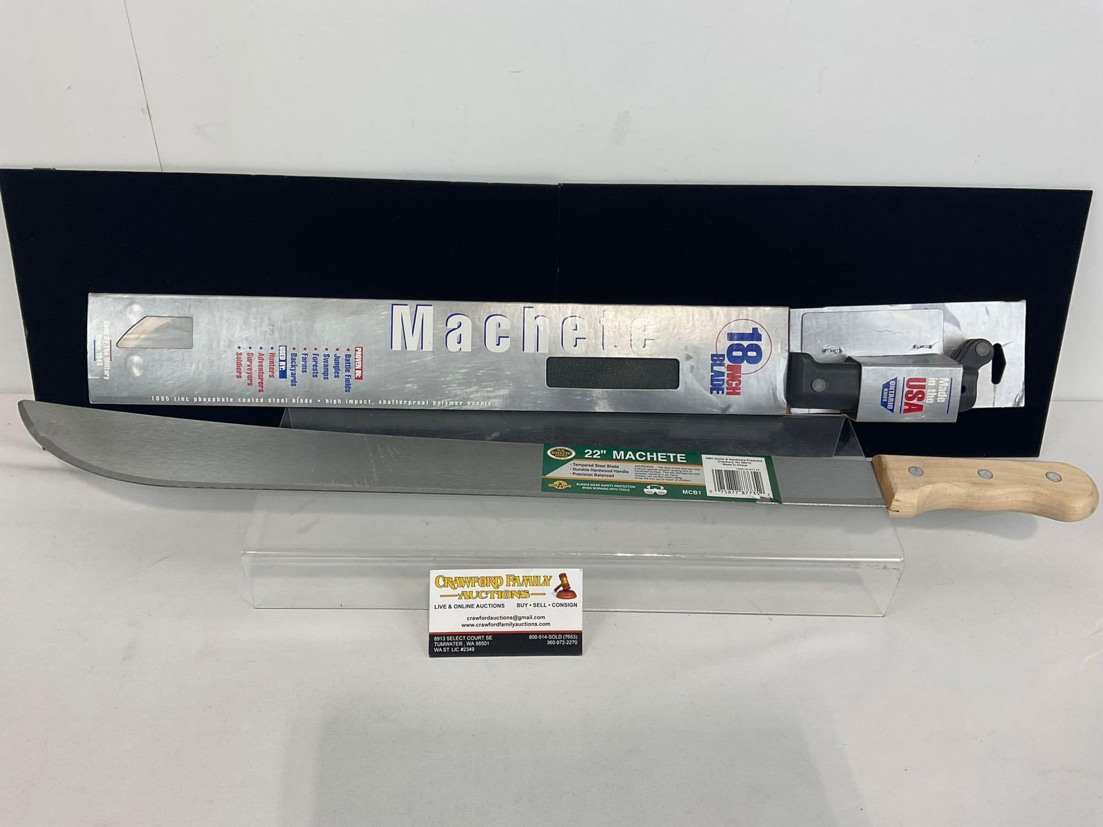 Pair of Machetes, 18 inch blade w/ polymer handle & 22 inch blade w/ wooden handle, both like new: Appears to be in good shape, appears unused. The pair measures approx 28h x 4w x 3d inches. See pics. E-4360