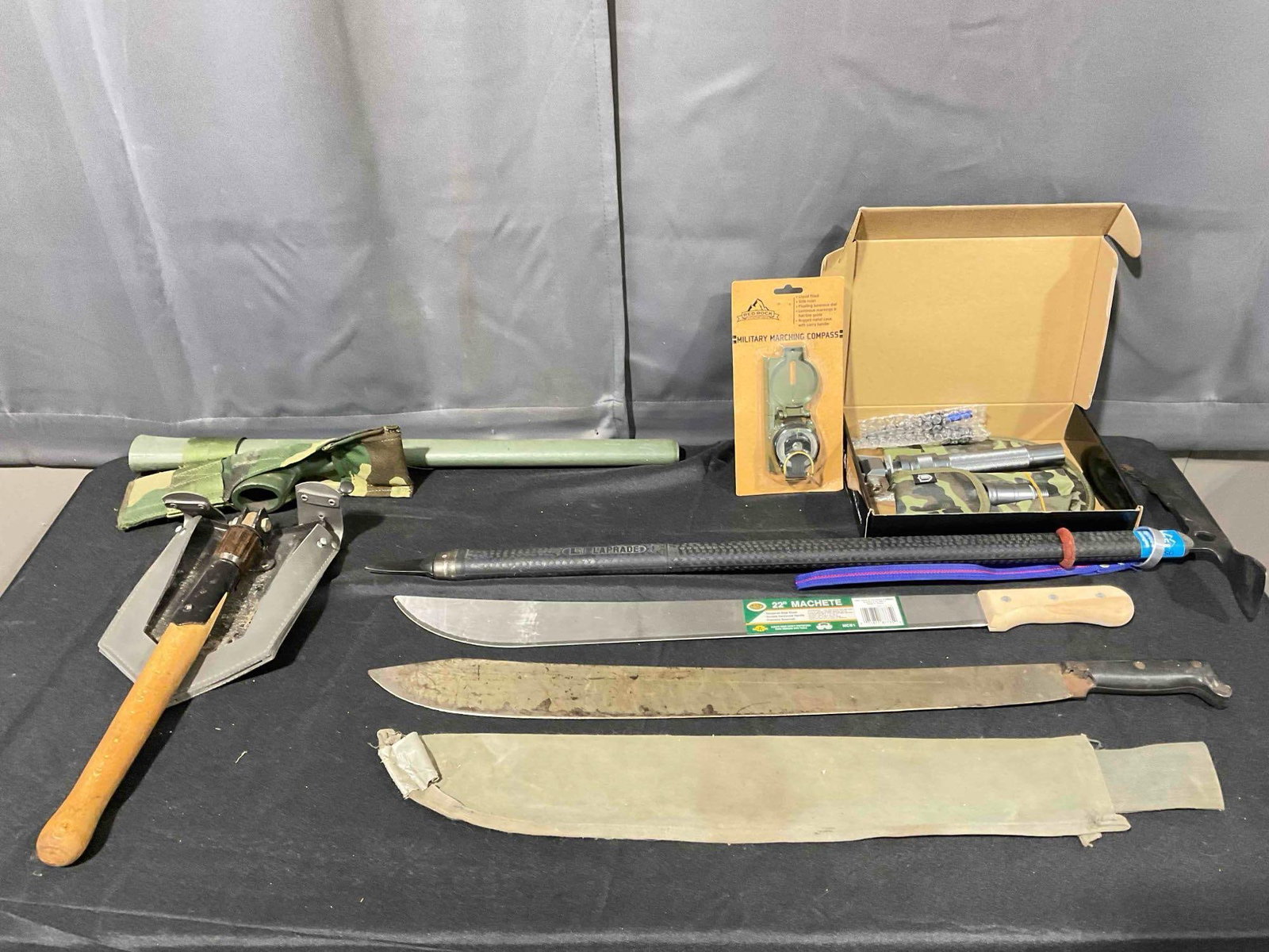8 pcs Military, Survival & Outdoor Gear incl. 2 Machetes, Laprade Montagne Ice Axe & More!: 8 pcs Military, Survival & Outdoor Gear incl. 2 Machetes, Laprade Montagne Ice Axe & More! Also includes vintage folding cat hole trowel, pick axe, military marching compass NIP and NIB EvaTac
