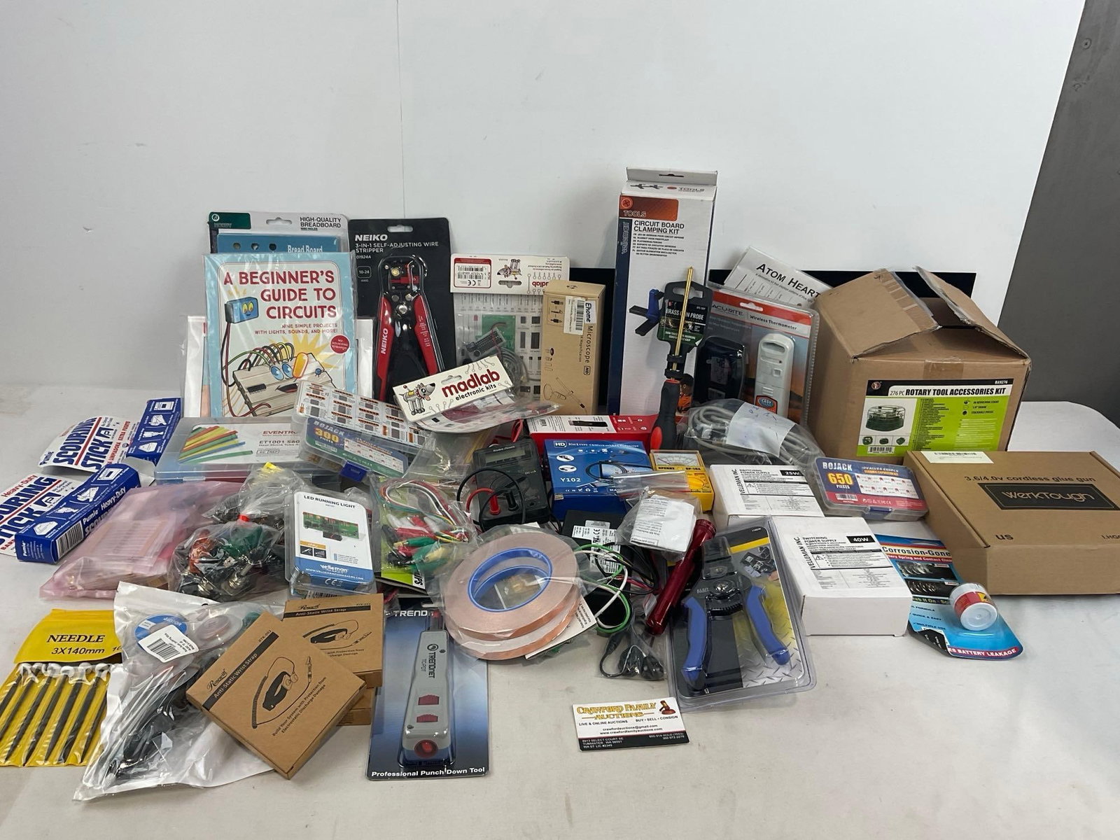 Large Assortment of Electronics Supplies & Tools, Wire Strippers, Clamping Kit, AntiStatic Bracel...: Includes more piece, Rotary tool accessory kit, glue gun, bread board, manuals, scouring sticks, power supplies & more. Appears to be in good shape. The pieces fit in a box that measures approx 13
