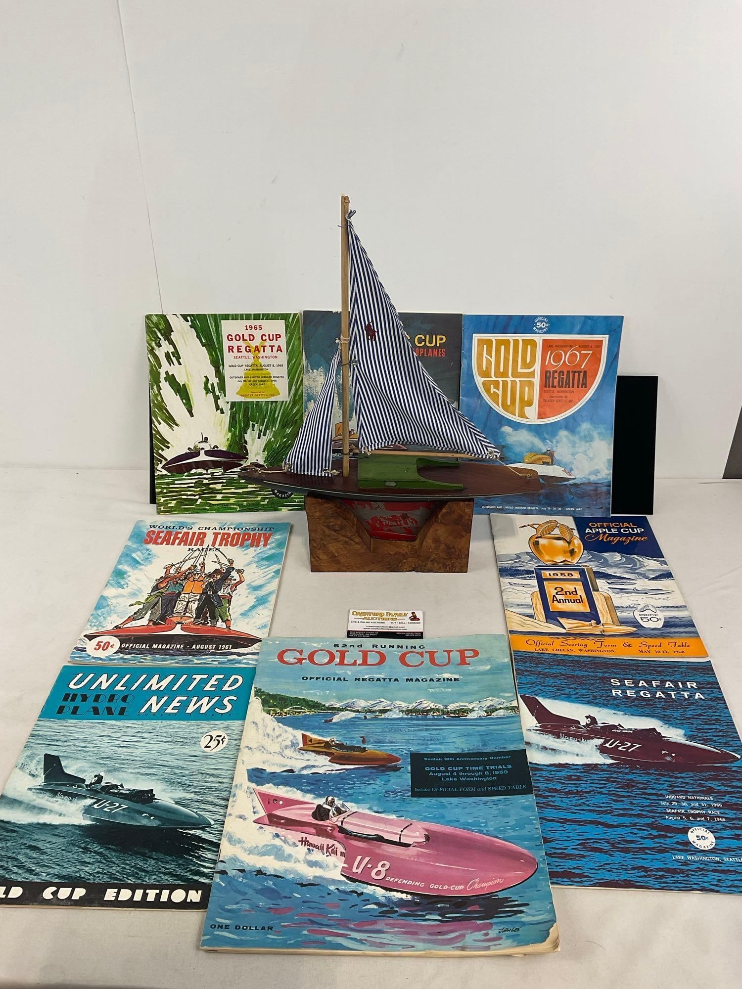 Vintage Regatta Racing Boat w/ Polo Ralph Lauren Shirt Sails & 8 1960s Boat Racing Magazines: Appears to be in good shape. The piece measures approx 4h x 19w x 13d inches. See pics. E-4400