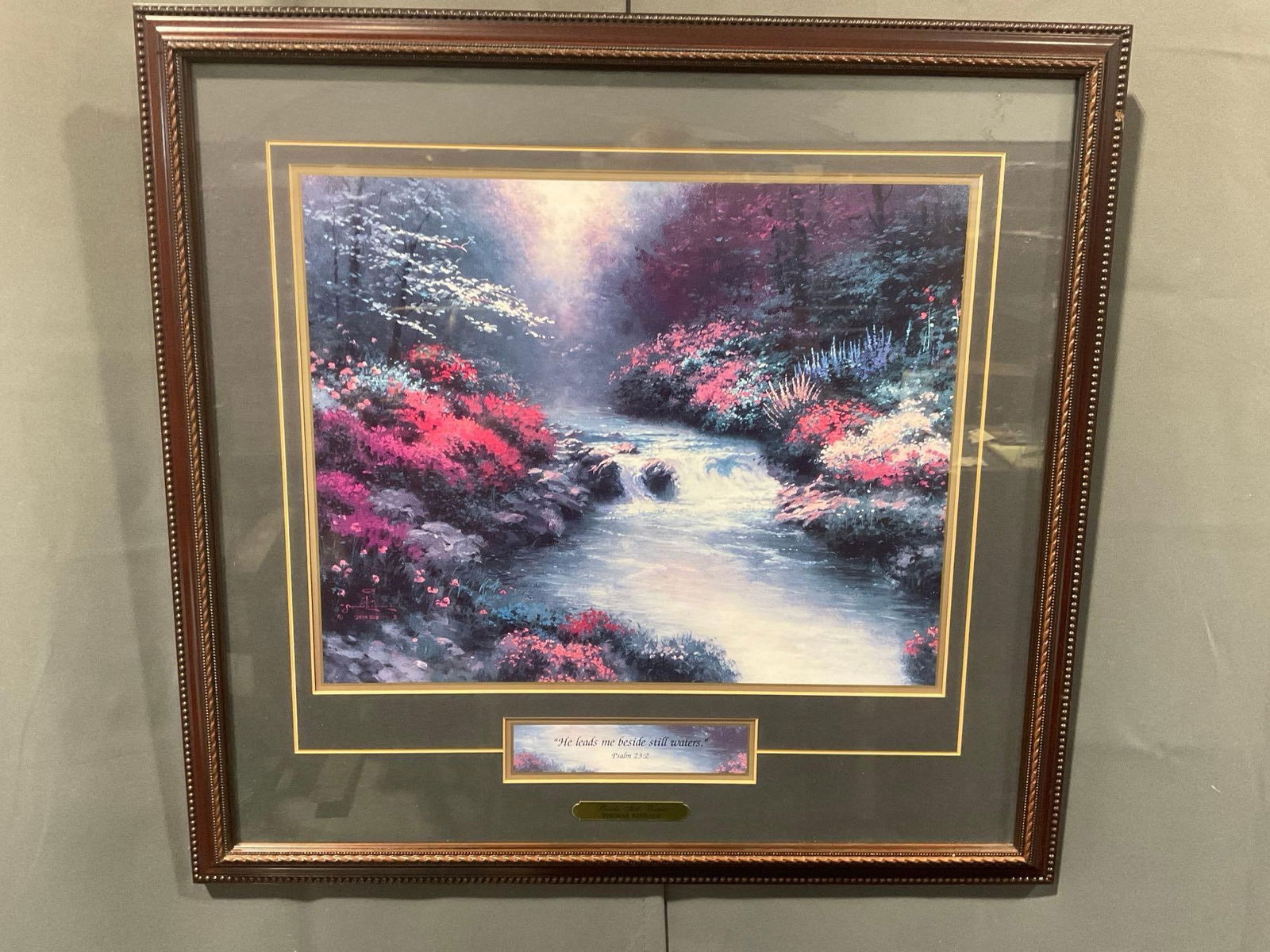 Framed Thomas Kinkade Print, titled Beside Still Waters w/ COA, approx 22h x 23w x 2d inches: Appears to be in good shape. The outside dimensions measure approx 22h x 23w x 2d inches. See pics. E-4600