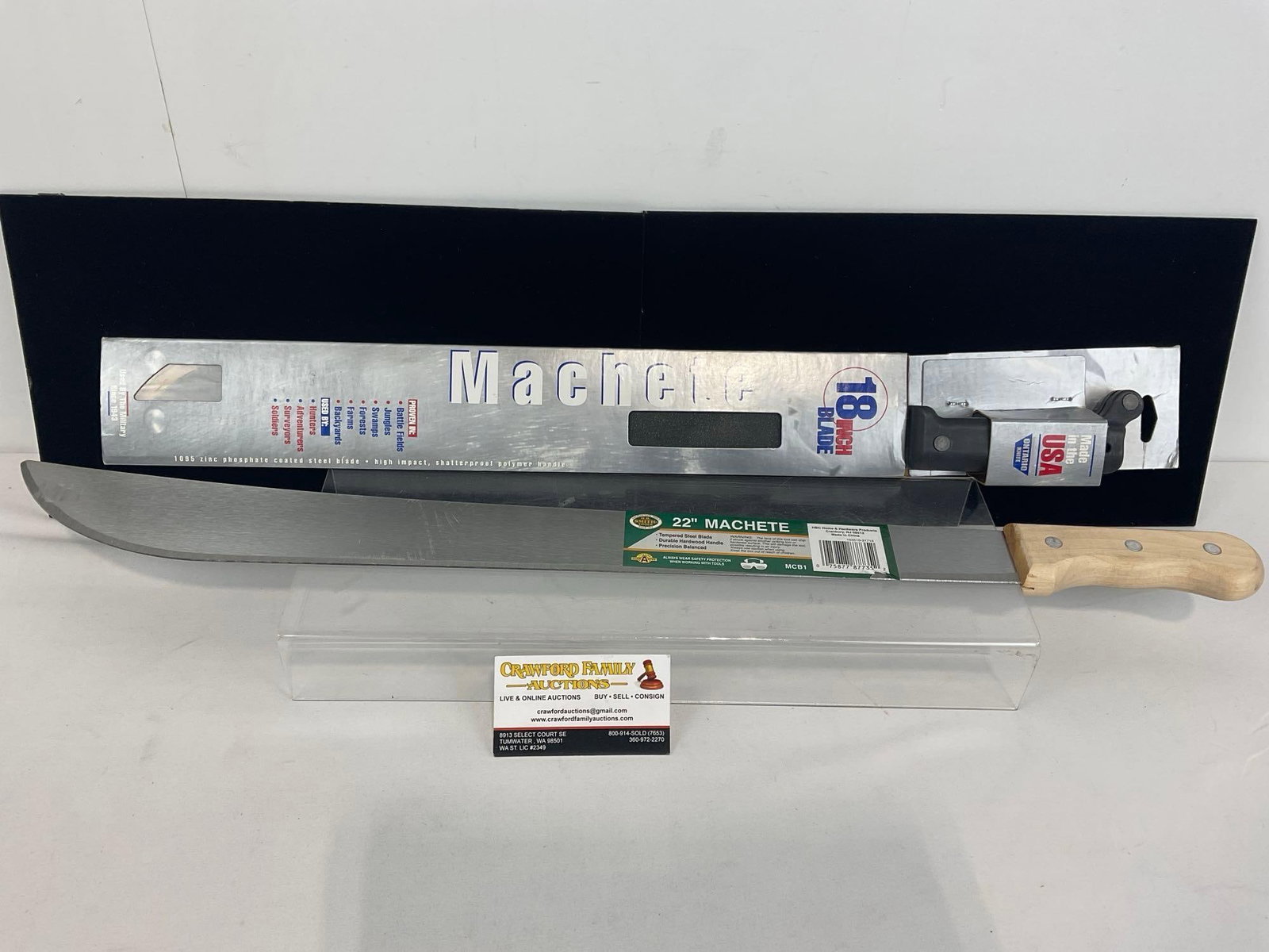 Pair of Machetes, 18 inch blade w/ polymer handle & 22 inch blade w/ wooden handle, both like new: Appears to be in good shape, appears unused. The pair measures approx 28h x 4w x 3d inches. See pics. E-4360