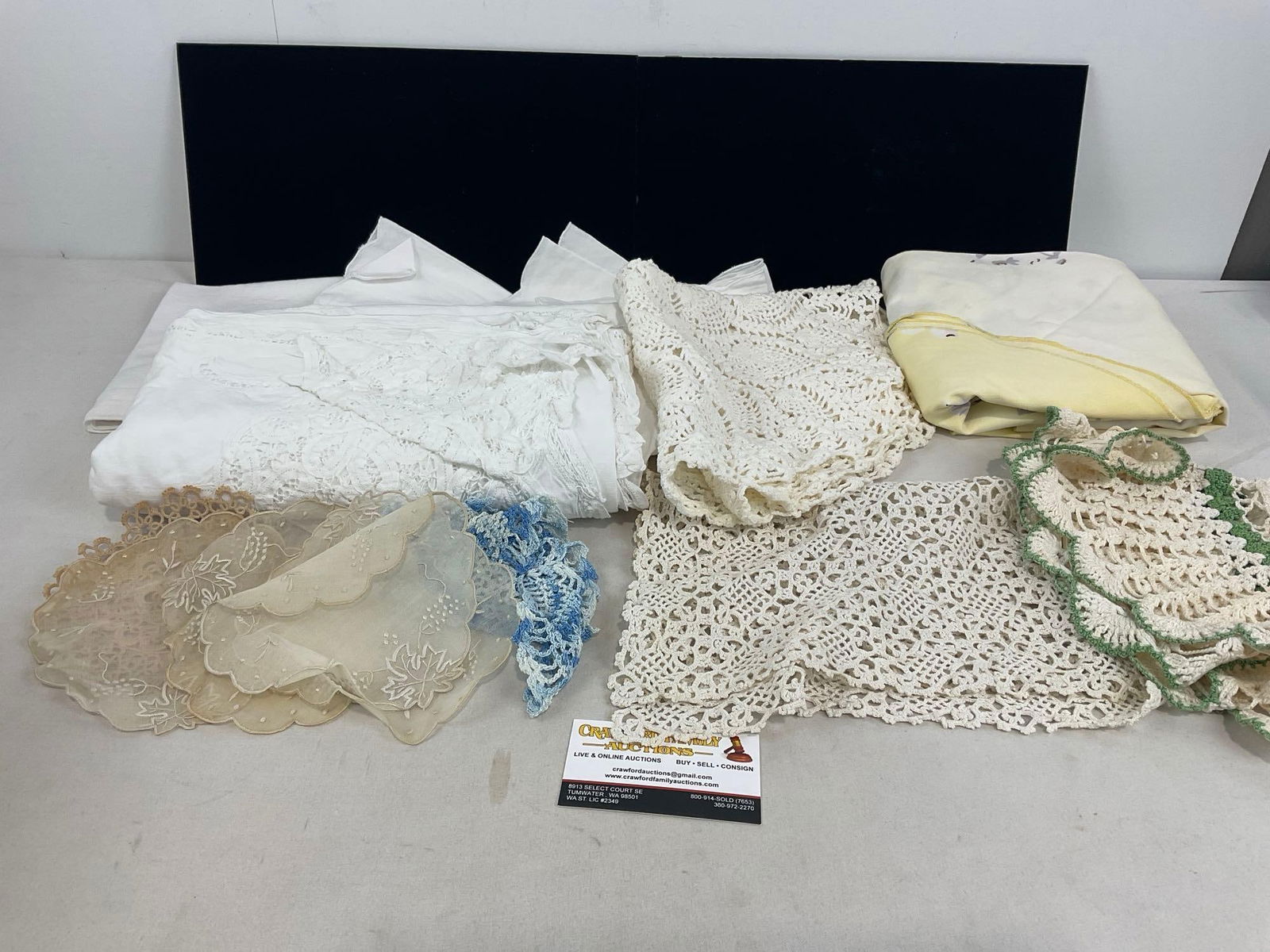 Lovely Collection of Doilies, Lace, Place Settings, Table Cloths: Appears to be in good shape. The piece measures approx 10h x 13w x 8d inches. See pics. E-4550