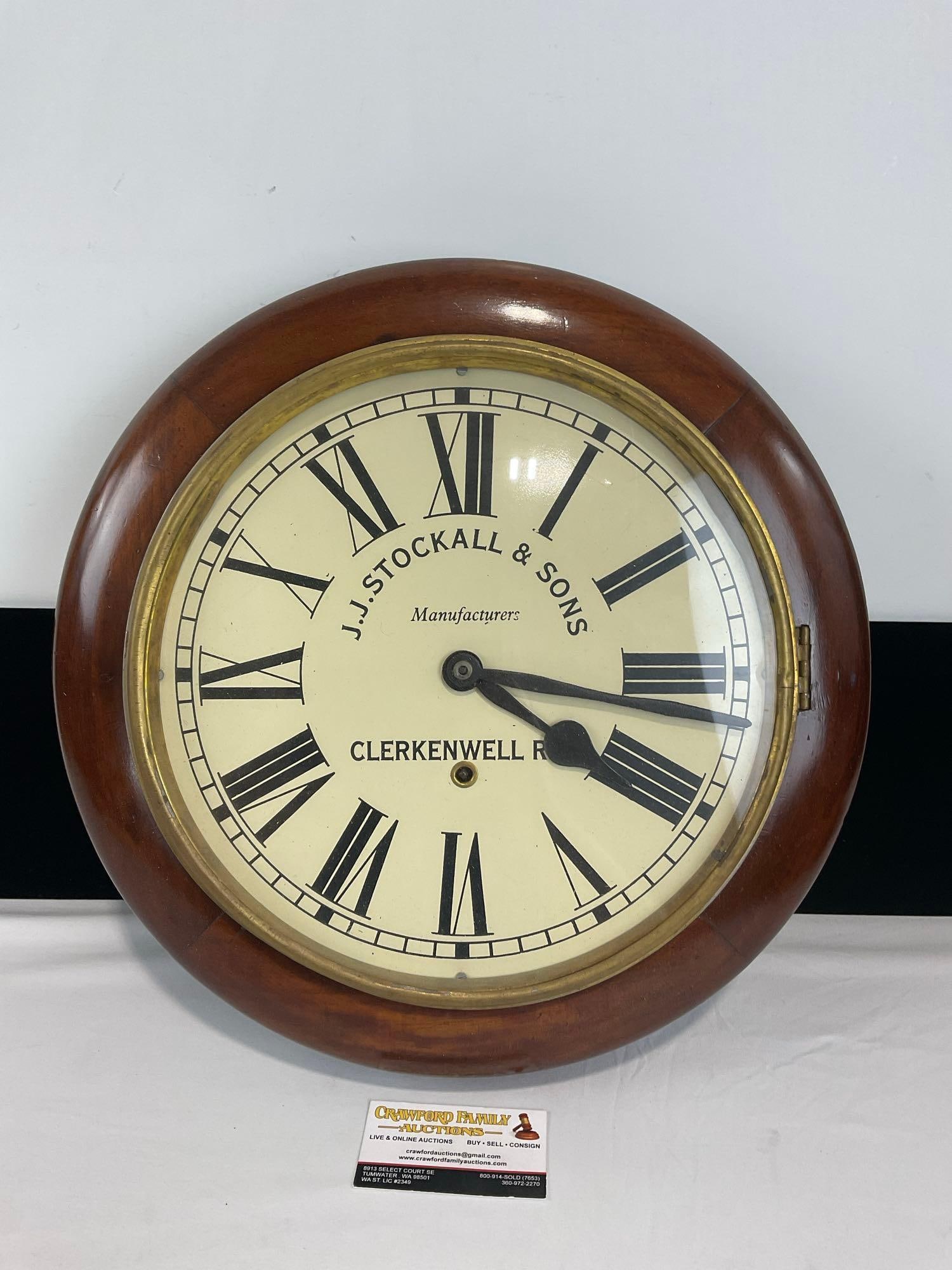 Antique J.J.Stockall & Sons Wall Clock w/ Pendulum & Key, Wooden w/ Brass Bezel: Appears to be in good shape. The piece measures approx 17h x 17w x 6d inches. See pics. E-4730