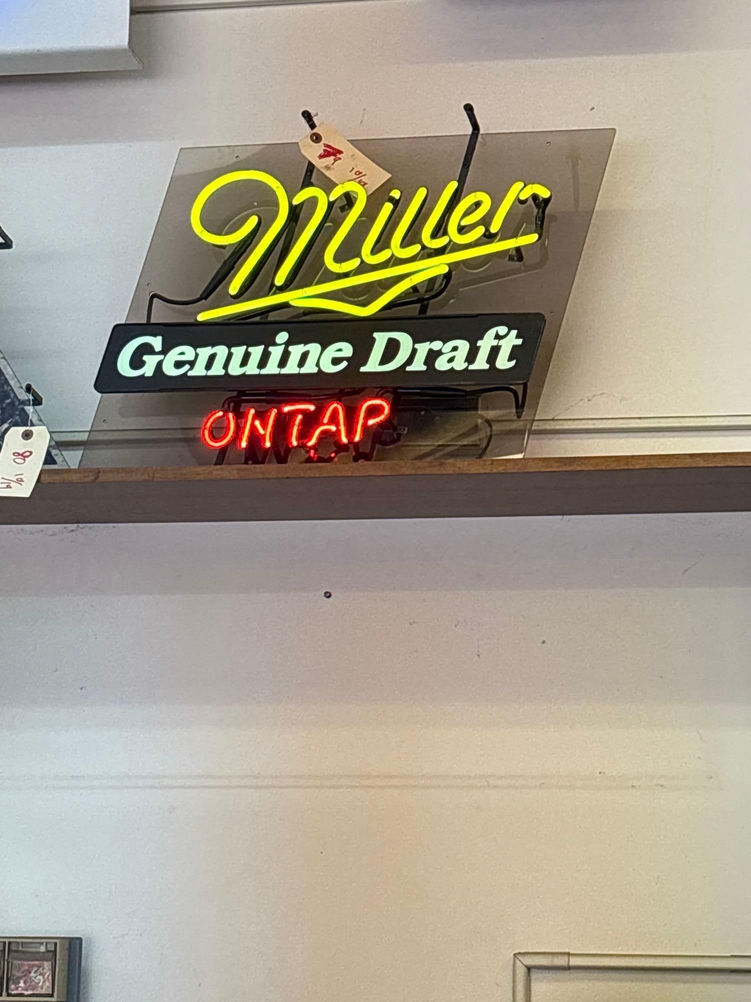 vintage Miller, genuine draft on tap neon beer sign, plugged in works: C4890 approximately 25 inches wide to 30 inches wide lights up and works This item is off site in Puyallup WA and will be available for pick up after the auction. The winning bidder will be give