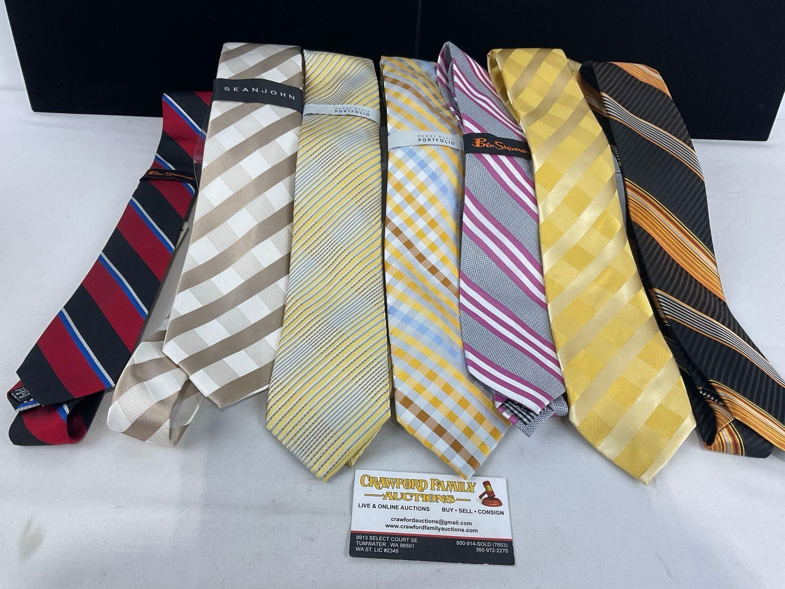 Set of 7 Silk Dress Ties, 3x Perry Ellis Portfolio, 2x Sean John, 2x Ben Sherman, never worn: Kept in storage, never worn, most still have the tags on them. Appears to be in good shape. The pieces fit in a box that measures approx 7h x 9w x 12d inches. See pics. E-4720