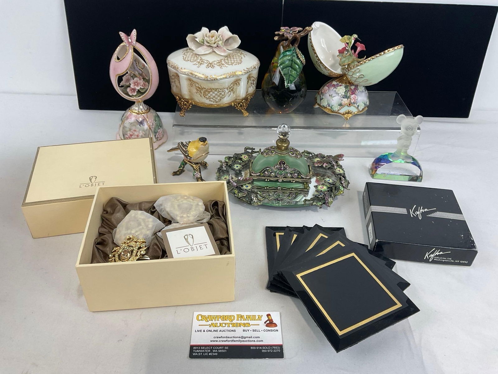 Assortment of Collectibles, Capodimonte Jewelry Box, Crystal Walt Disney World piece, Kafka Coast...: LObjet Napkin Rings, Pear Art Glass piece, & more. Appears to be in good shape. The pieces fit in a box that measures approx 8h x 9w x 12d inches. See pics. E-4720