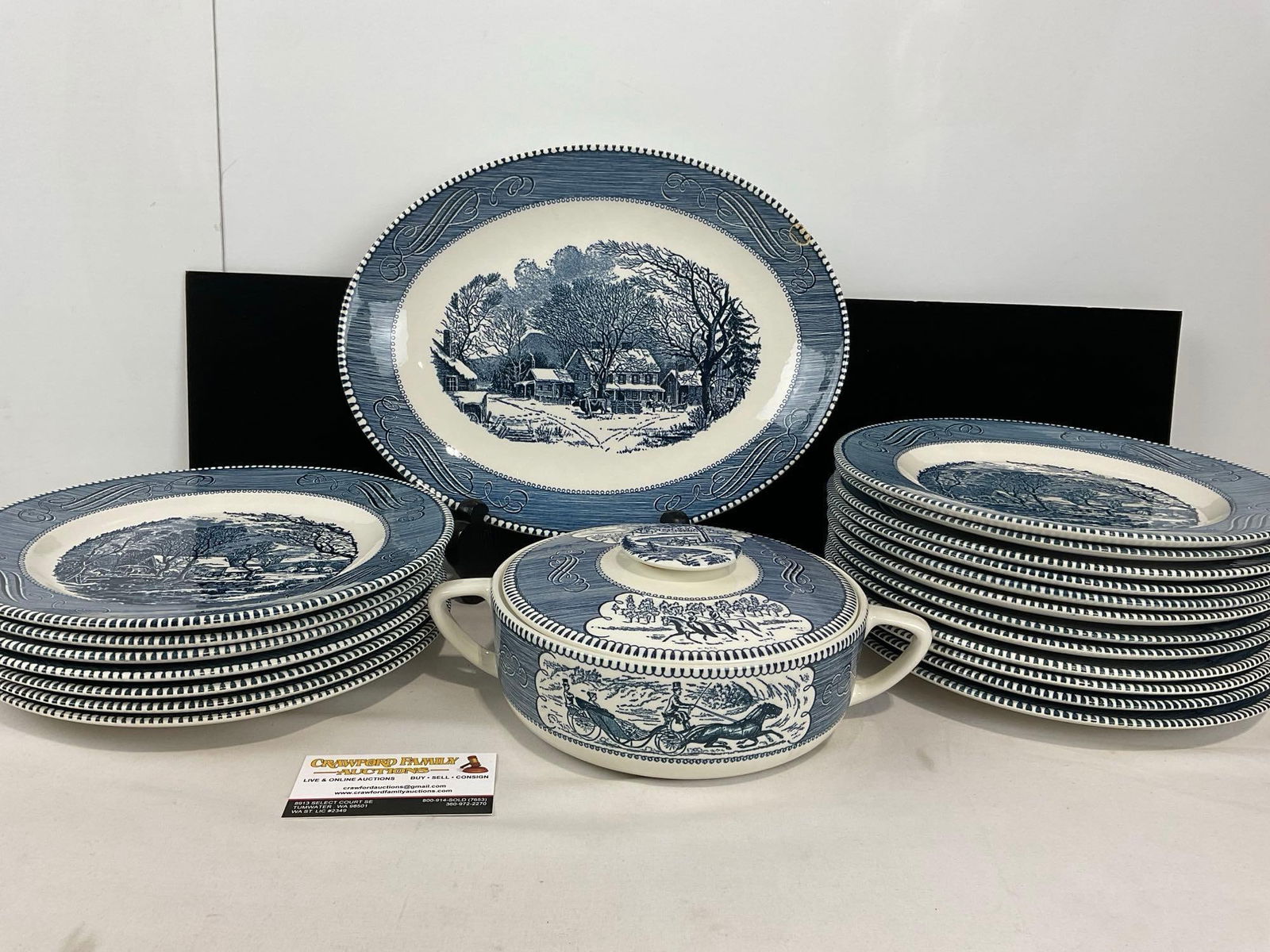 Vintage Currier & Ives by Royal China, 20 Blue/White pieces, Underglaze Print, Dinner Plates &: Soup Tureen. Includes: Platter, Lidded Soup Tureen, 7 dinner plates of one pattern, 12 of another. Appears to be in fair to good shape, the handle on the lid has been reattached to the piece. The piec