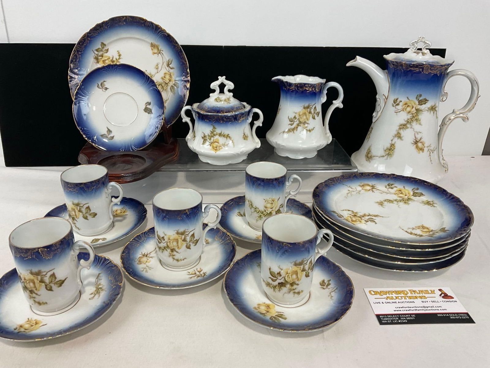 Antique KPM German Chocolate Set, Flow Blue Gradient, plates, cups & saucers, Pot, creamer & Sugar: Includes: 6 plates, 5 cups & 6 saucers, Chocolate Pot, creamer & Sugar. Appears to be in good shape. The set together measures approx 9h x 14w x 14d inches. See pics. E-4900 *Oversiz
