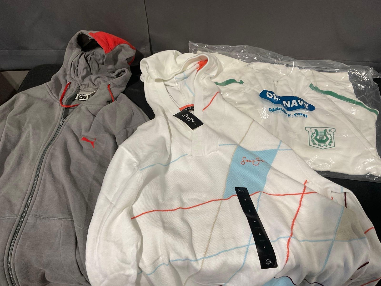 3 Mens Jackets, Size Medium Slim Fit, Sean John, Puma & Old Navy, never worn, some with tags on: Appears to be in good shape. The pieces are about the same size, slim fit. Pieces approx 10h x 16w x 10d inches when folded up. See pics. E-4720