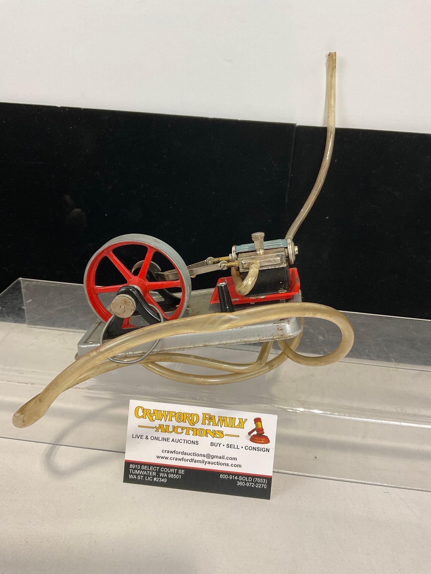 Vintage Wilesco Mini Steam Engine, Clear Tubes, & Painted Flywheel, 4h x 6w x 4d inches: Appears to be in good shape. The pieces fit in a box that measures approx 4h x 6w x 4d inches. See pics. E-4660