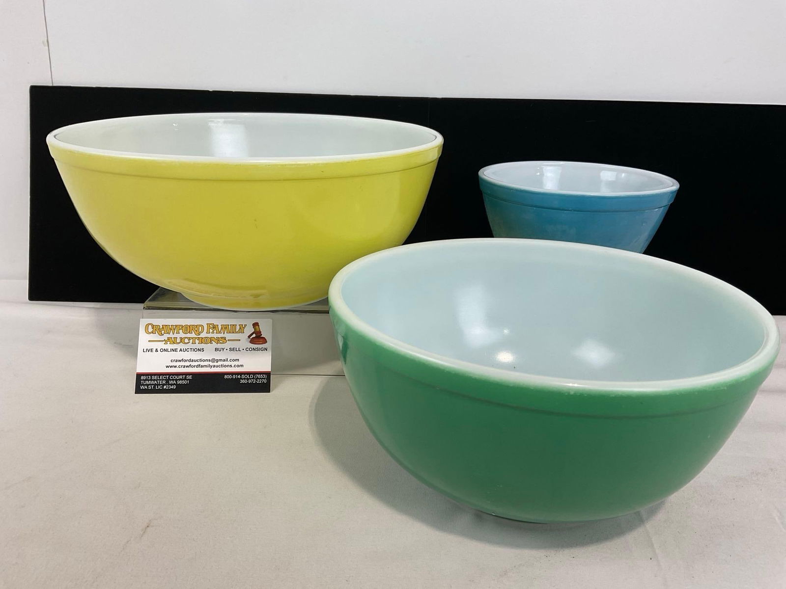 Three Colorful Pyrex Kitchen Bowls, 3 sizes, Yellow/Green/Blue, largest is 6h x 11w x 11d inches: Appears to be in good shape. The piece measures approx 6h x 11w x 11d inches. See pics. E-4690