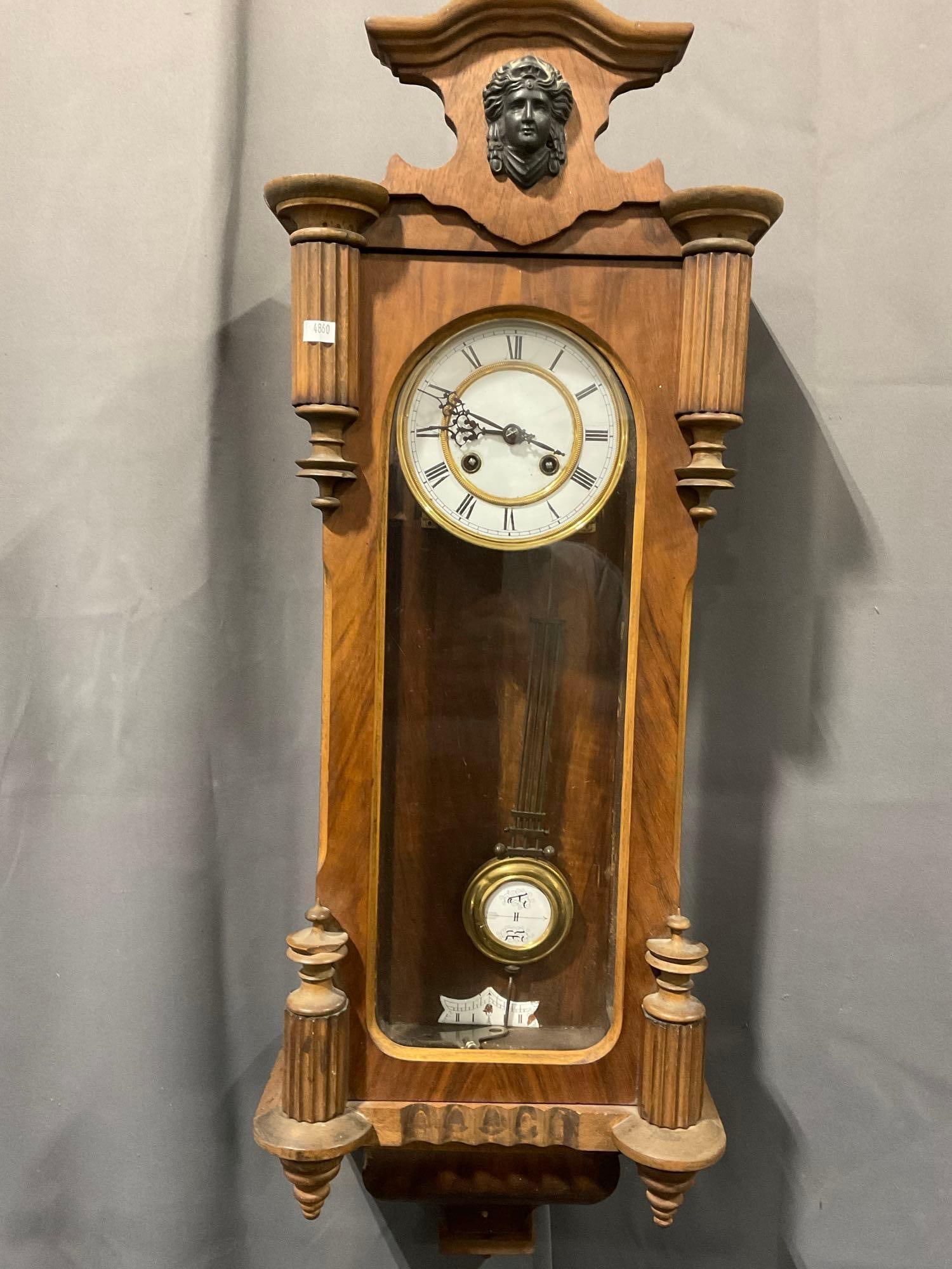 Vintage Rudolf Buehler Time Strike Wall Clock, Carved Wood & Glass, approx 32h x 13w x 8d inches: Includes Pendulum & Key. Appears to be in good shape. The piece measures approx 32h x 13w x 8d inches. See pics. E-4860 *Oversized shipping may apply*