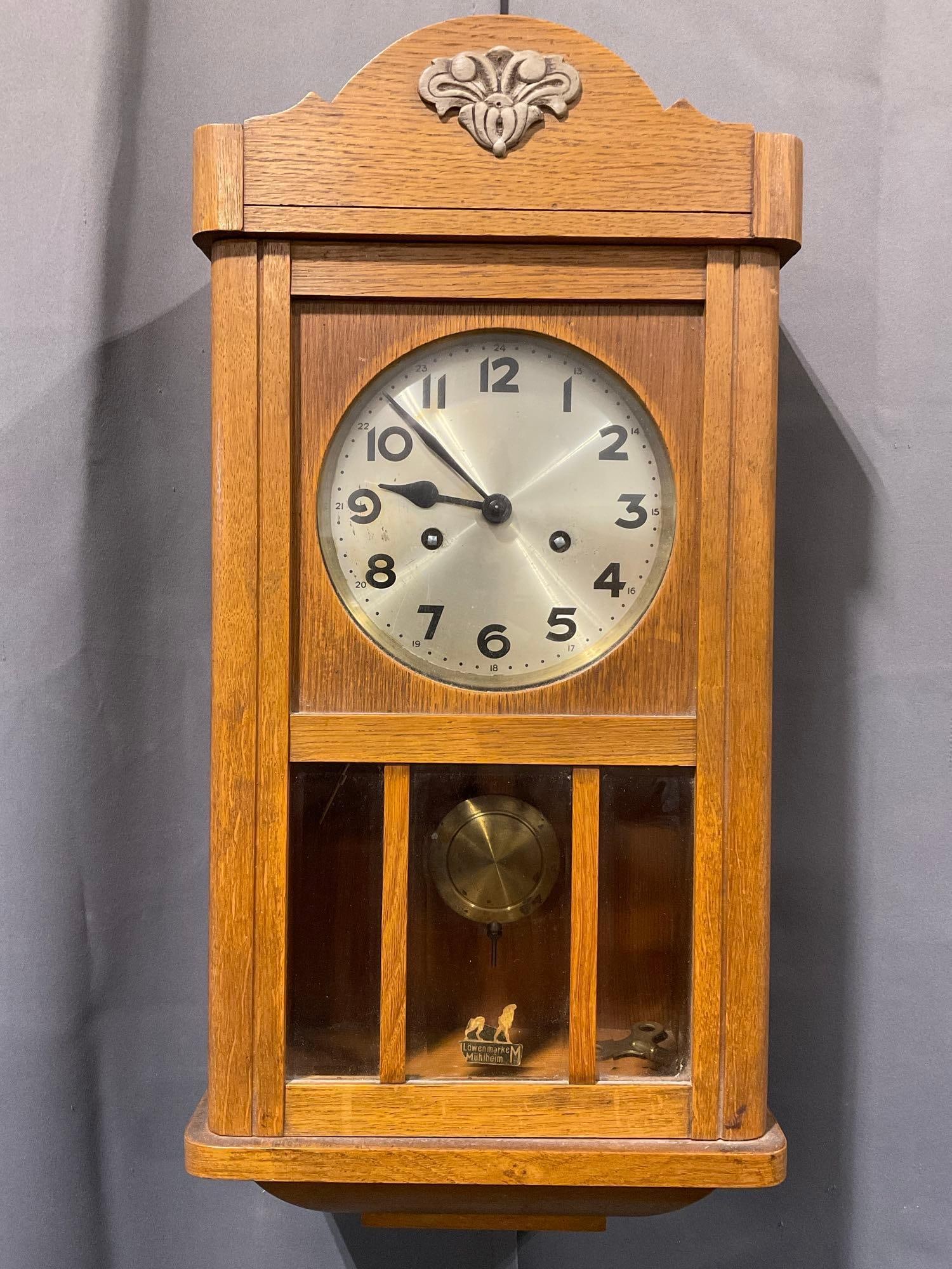 Vintage German Lowenmarke Muhlheim Time Strike Wall Clock w/Pendulum & Key, 23h x 11w x 7d inches: Includes Pendulum & Key. Appears to be in good shape. The piece measures approx 23h x 11w x 7d inches. See pics. E-4860