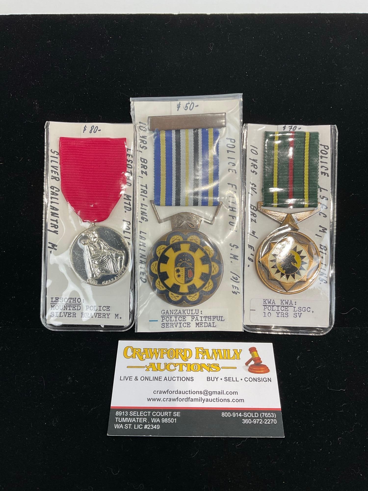 3 African Medals, Lesotho Mounted Police, Ganzakulu Police Faithful Service & Police LSGC 10 Years: All from a single collection, these are briefly described on the tag and were kept in a display. They measure approx 6h x 3w x 2d inches. See pics. E-5300