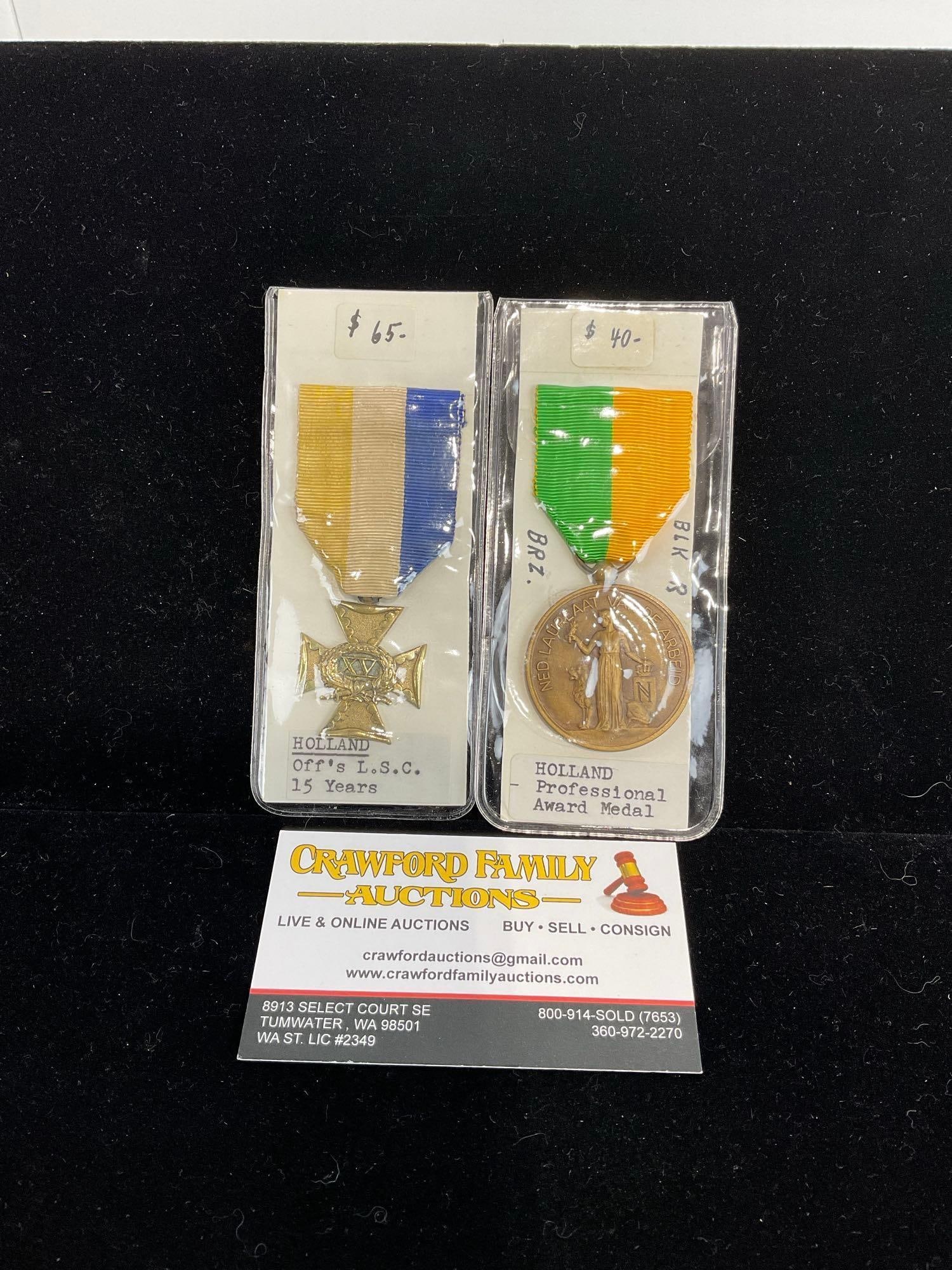 Pair of Dutch Medals, Holland Officers LSC 15 Years & Professional Award, Bronze: All from a single collection, these are briefly described on the tag and were kept in a display. They measure approx 6h x 3w x 2d inches. See pics. E-5300